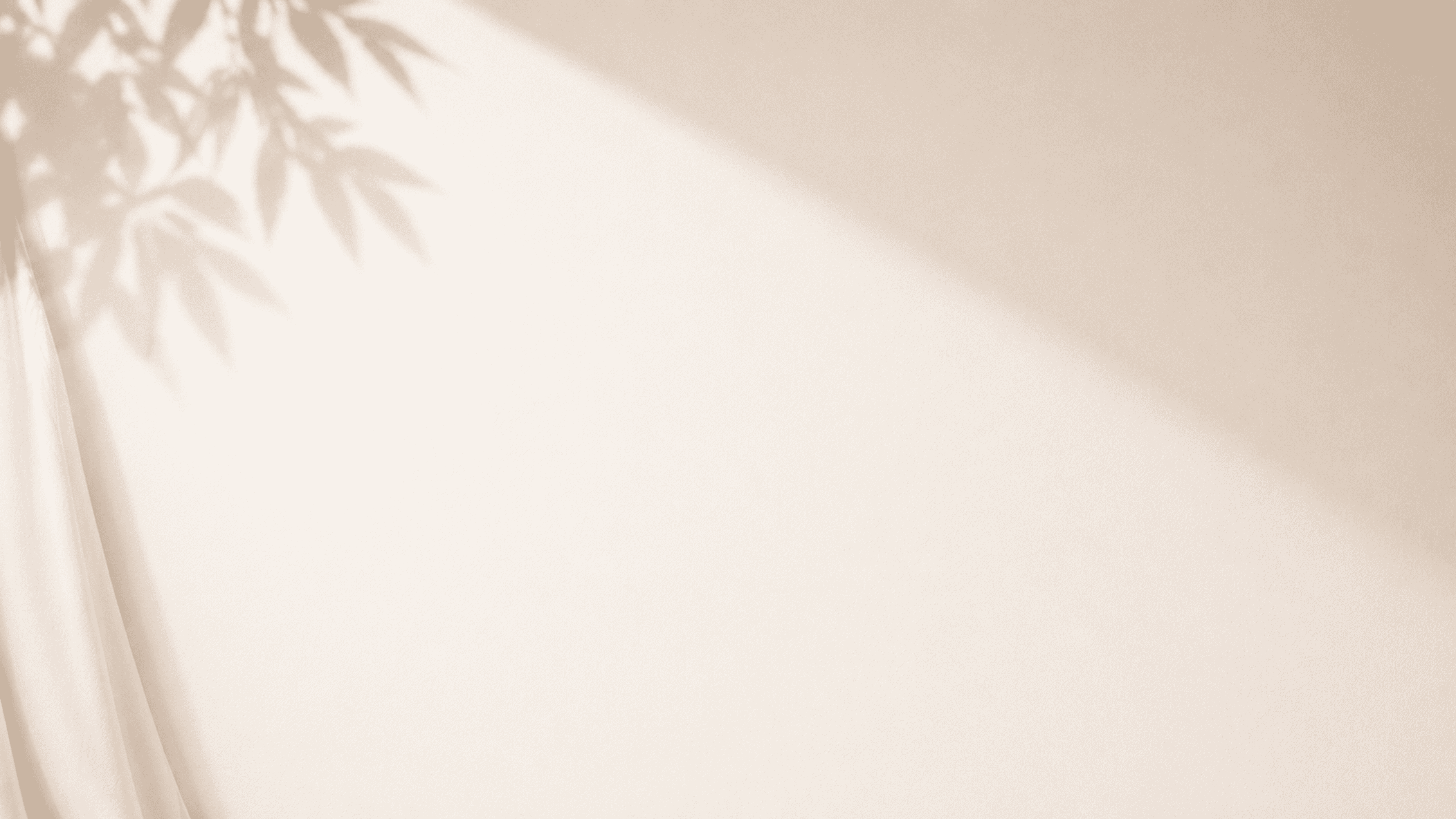 A close-up of a serene face illuminated by soft light, with shadows creating a patterned effect across the skin.