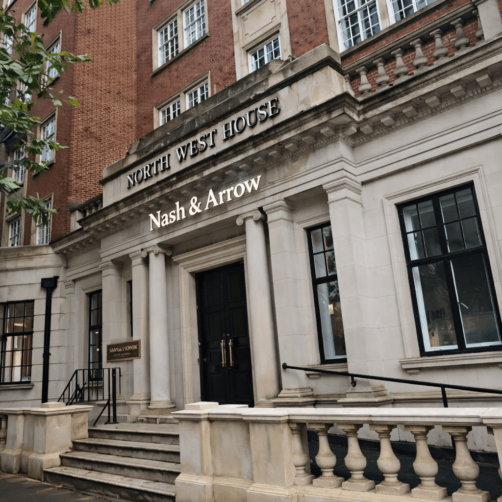 Exterior of a building with orange awnings and a sign above the door that reads “Prospect.”