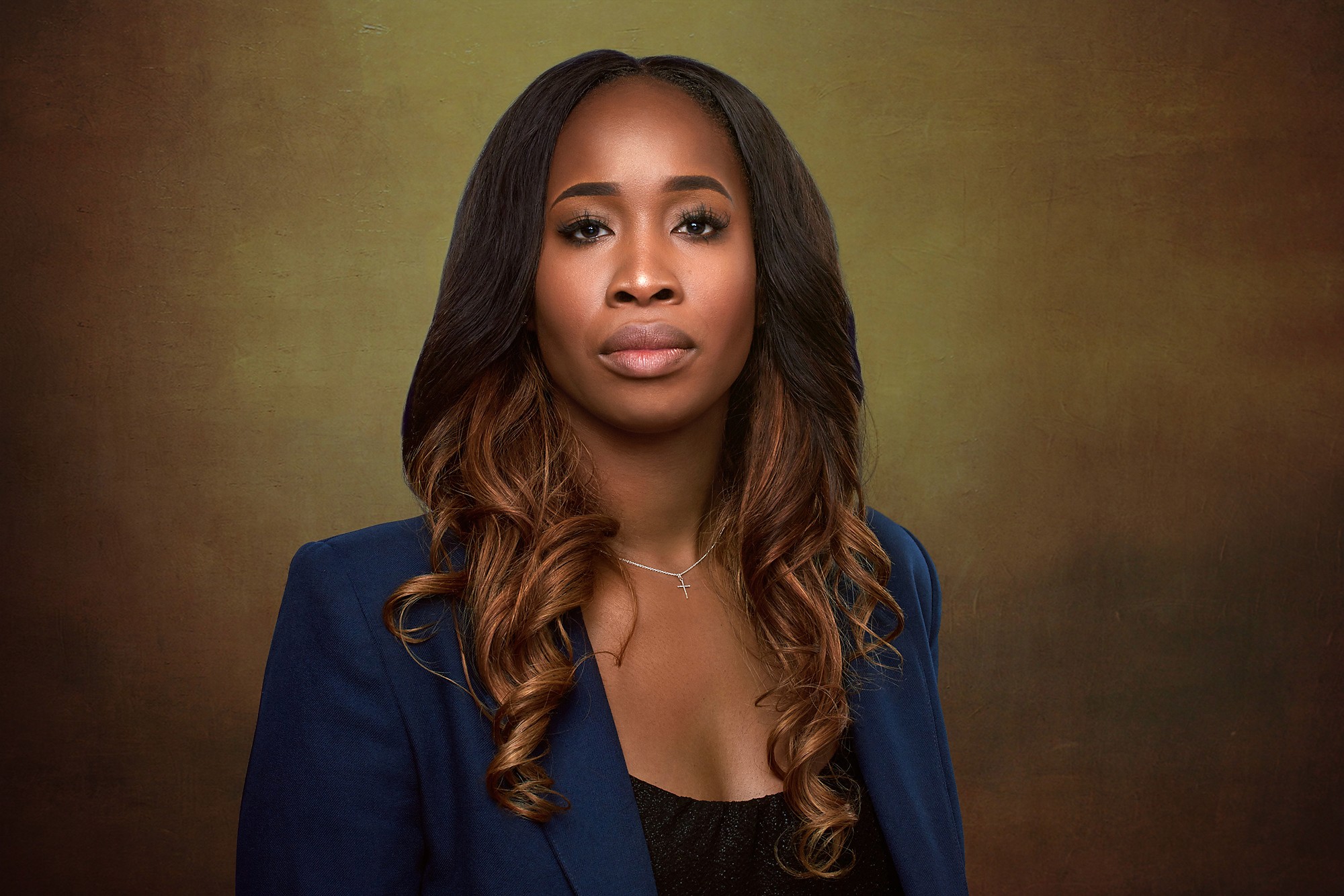 Natural light portrait of South Asian woman smiling with scarf