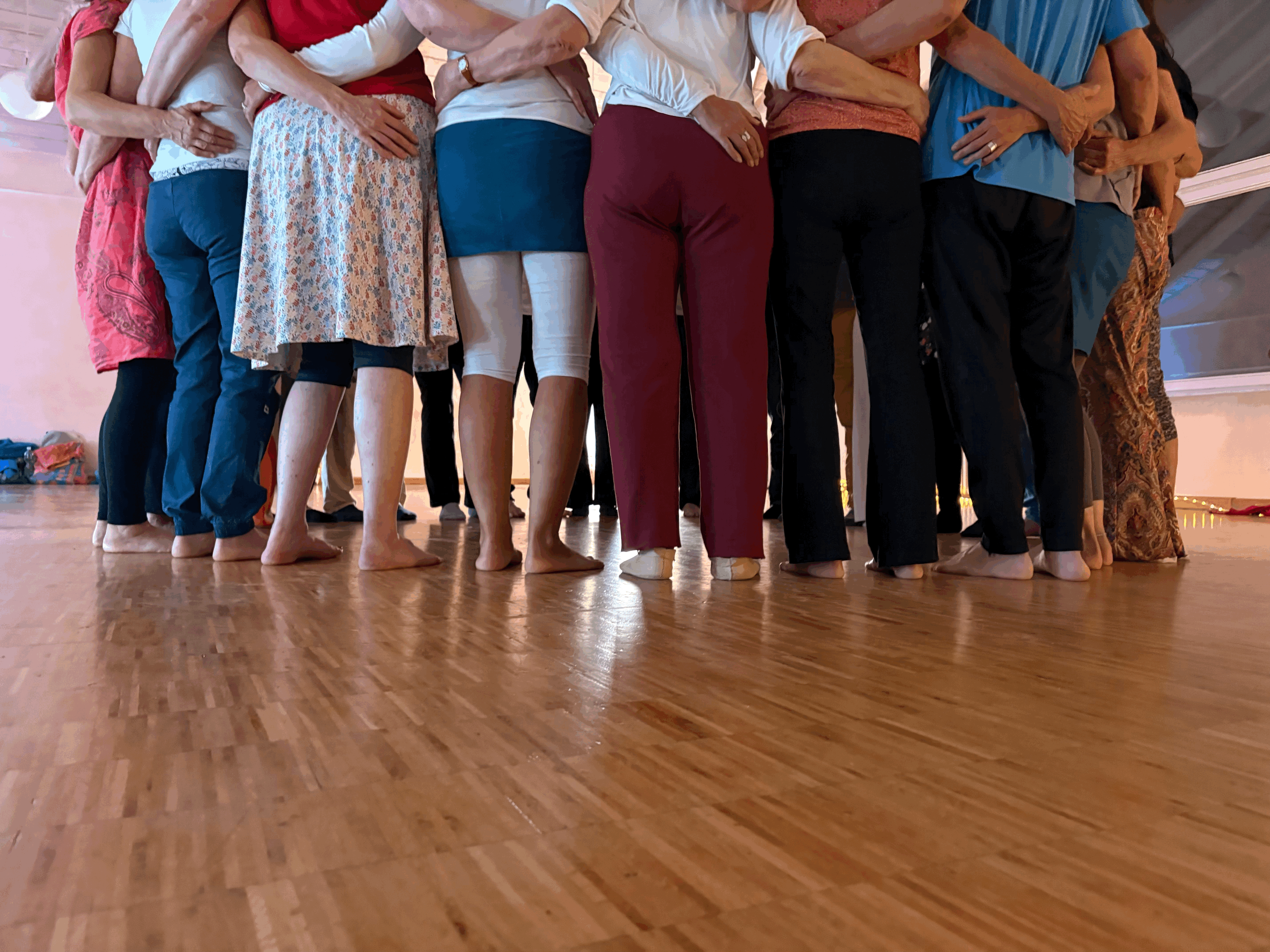 A luxurious indoor pool area with a panoramic view of a city at sunset. Comfortable lounge beds with soft fabrics surround the pool, while warm ambient lighting enhances the sophisticated atmosphere. The space combines modern elegance with a tranquil vibe.