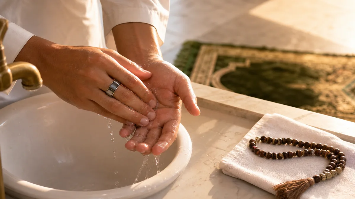 Smart tasbih ring worn during wudu beside misbaha beads and a prayer mat