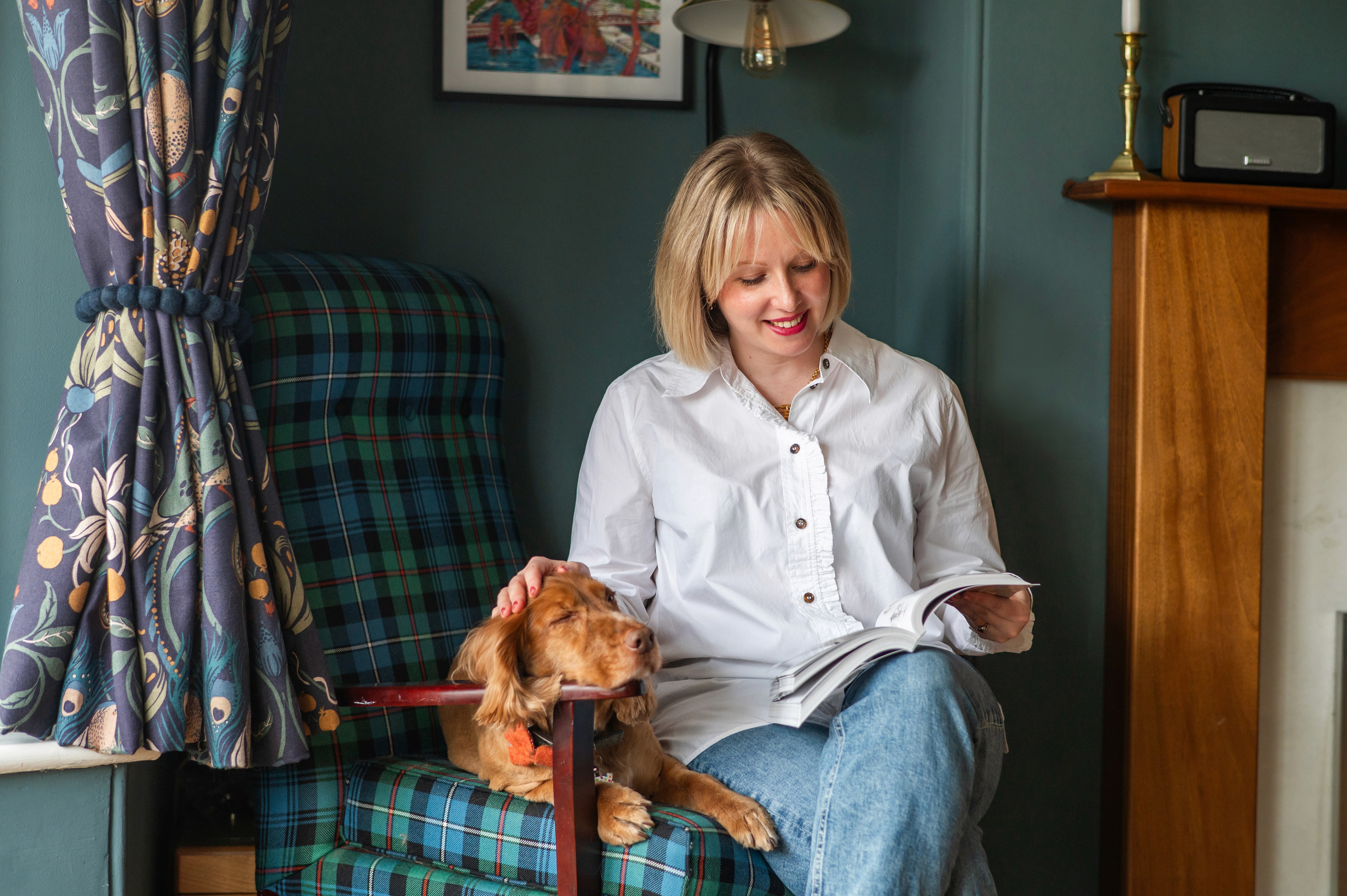 Background image featuring a modern interior design space for the testimonial Card