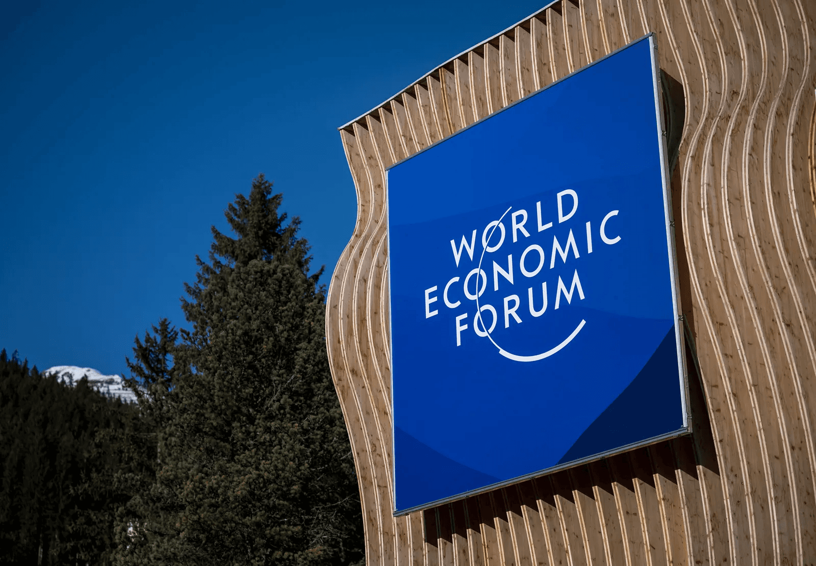 A woman receives a relaxing energy healing in a serene setting with soft lighting.