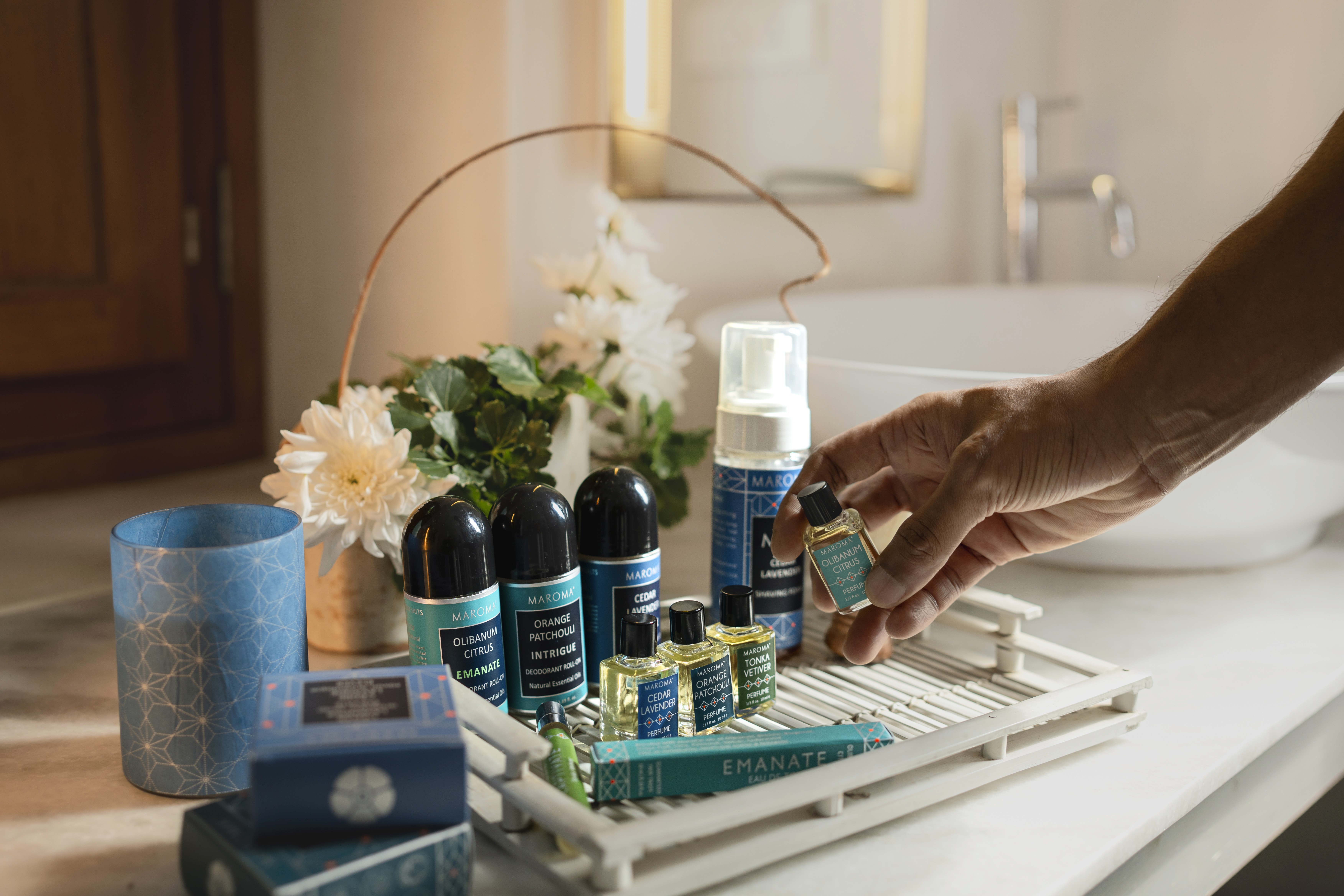 A luxurious indoor pool area with a panoramic view of a city at sunset. Comfortable lounge beds with soft fabrics surround the pool, while warm ambient lighting enhances the sophisticated atmosphere. The space combines modern elegance with a tranquil vibe.