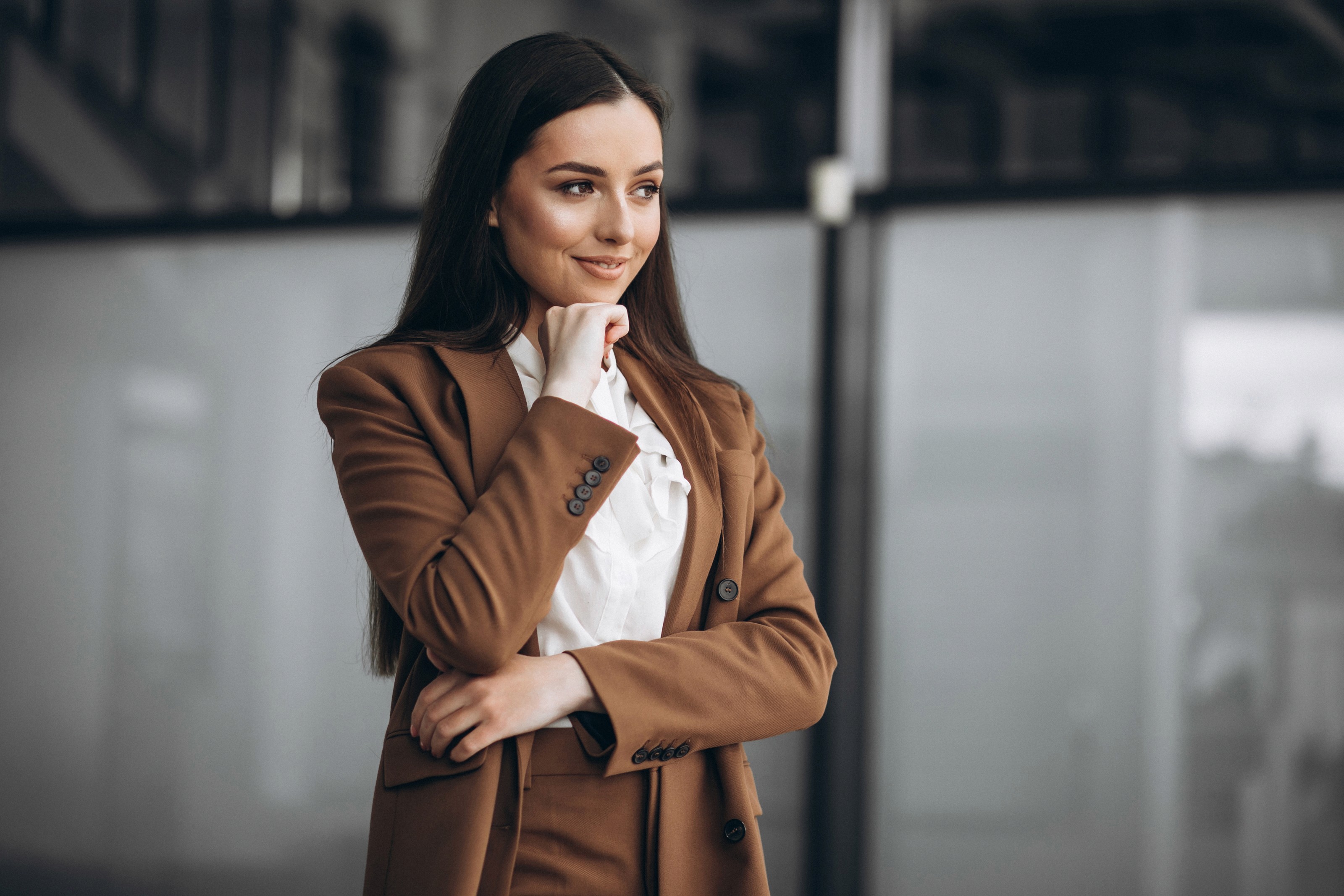 Confident businesswoman wearing a brown suit