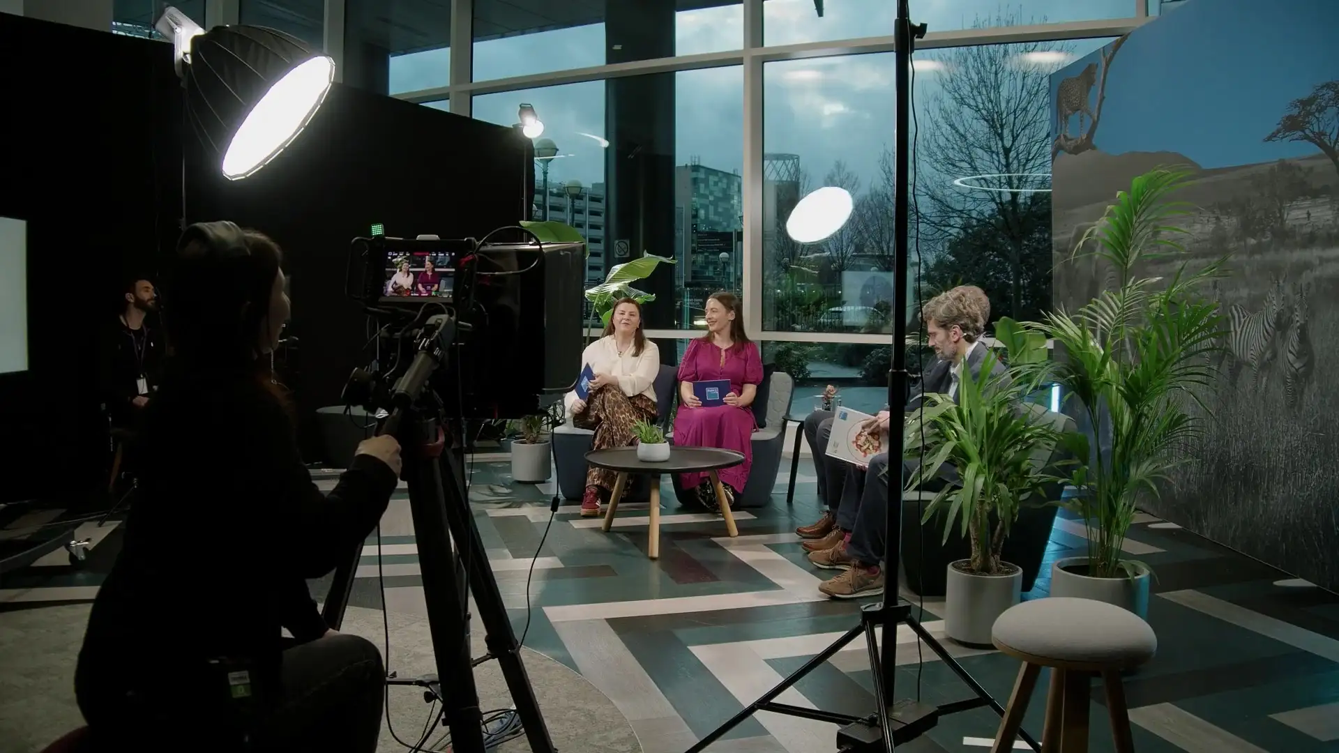 Behind-the-scenes view of a studio setup for a Bupa strategy broadcast, showing cameras, lighting and presenters