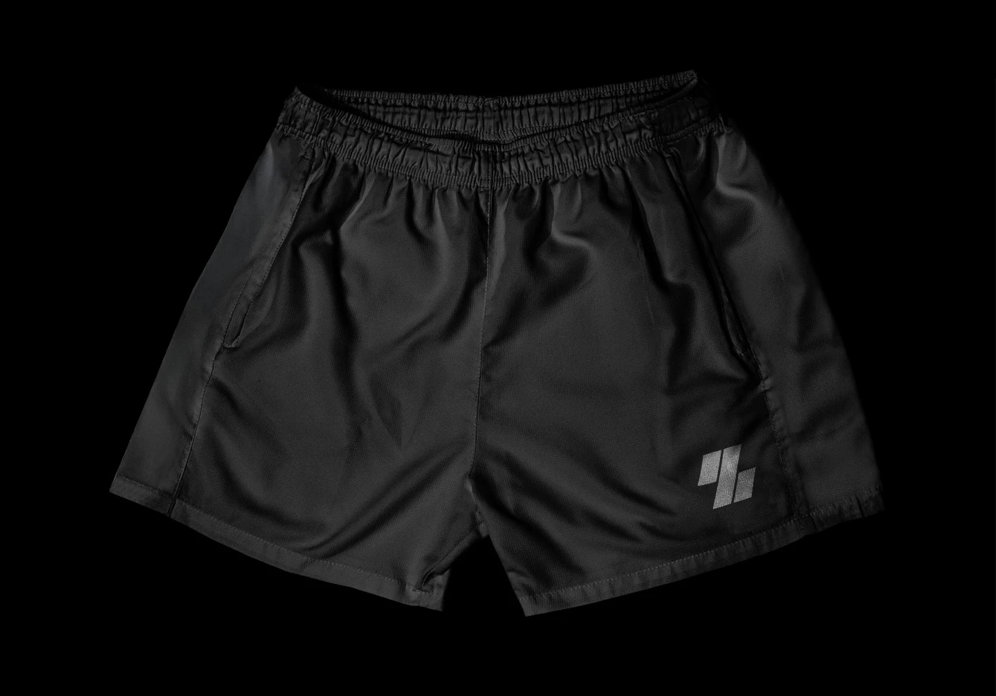 Model standing elegantly next to a vintage car, facing away from the camera, dressed in a timeless black ensemble and vintage hat.