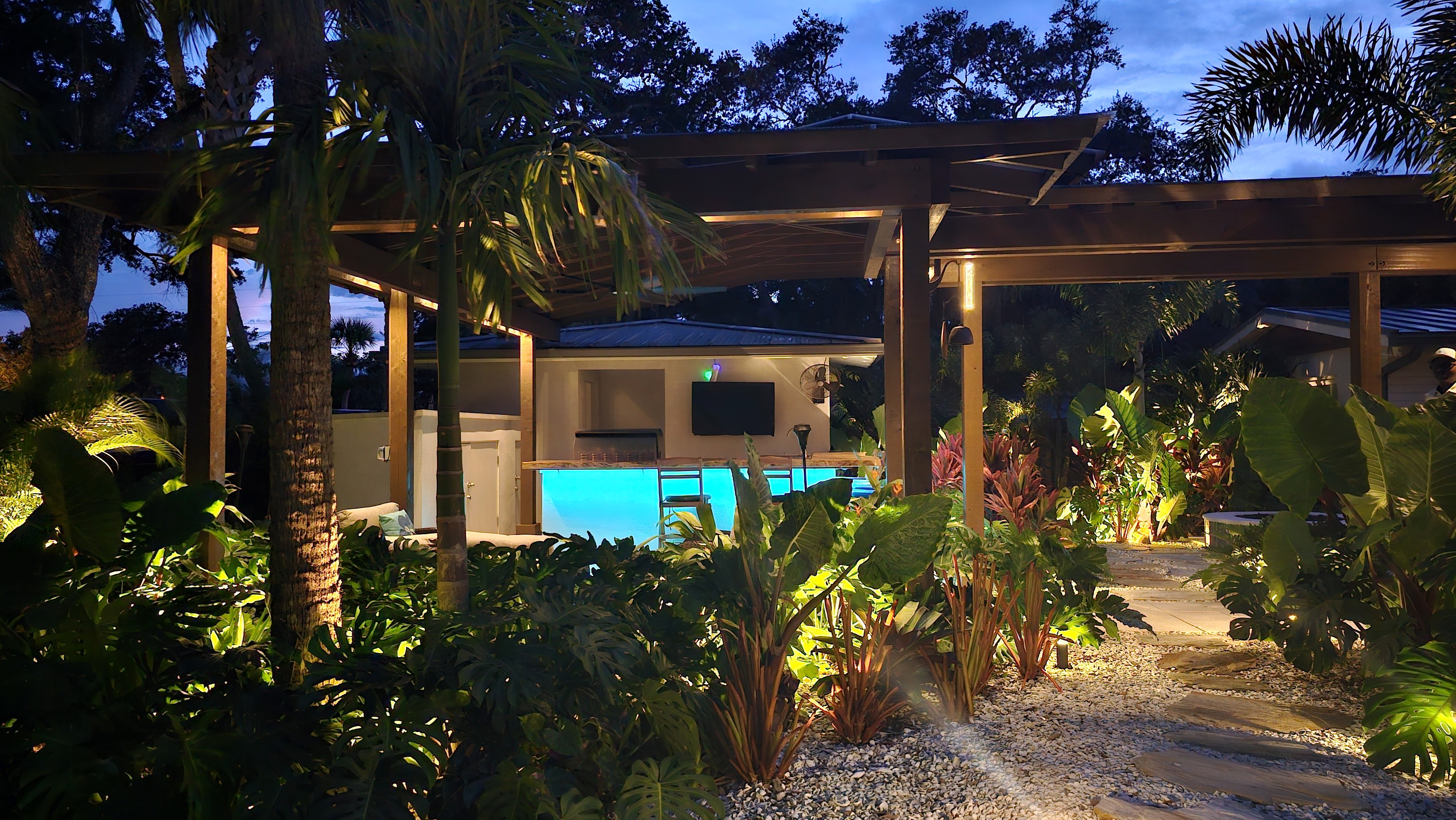 Pergola and garden pathway illuminated for outdoor relaxation and entertaining