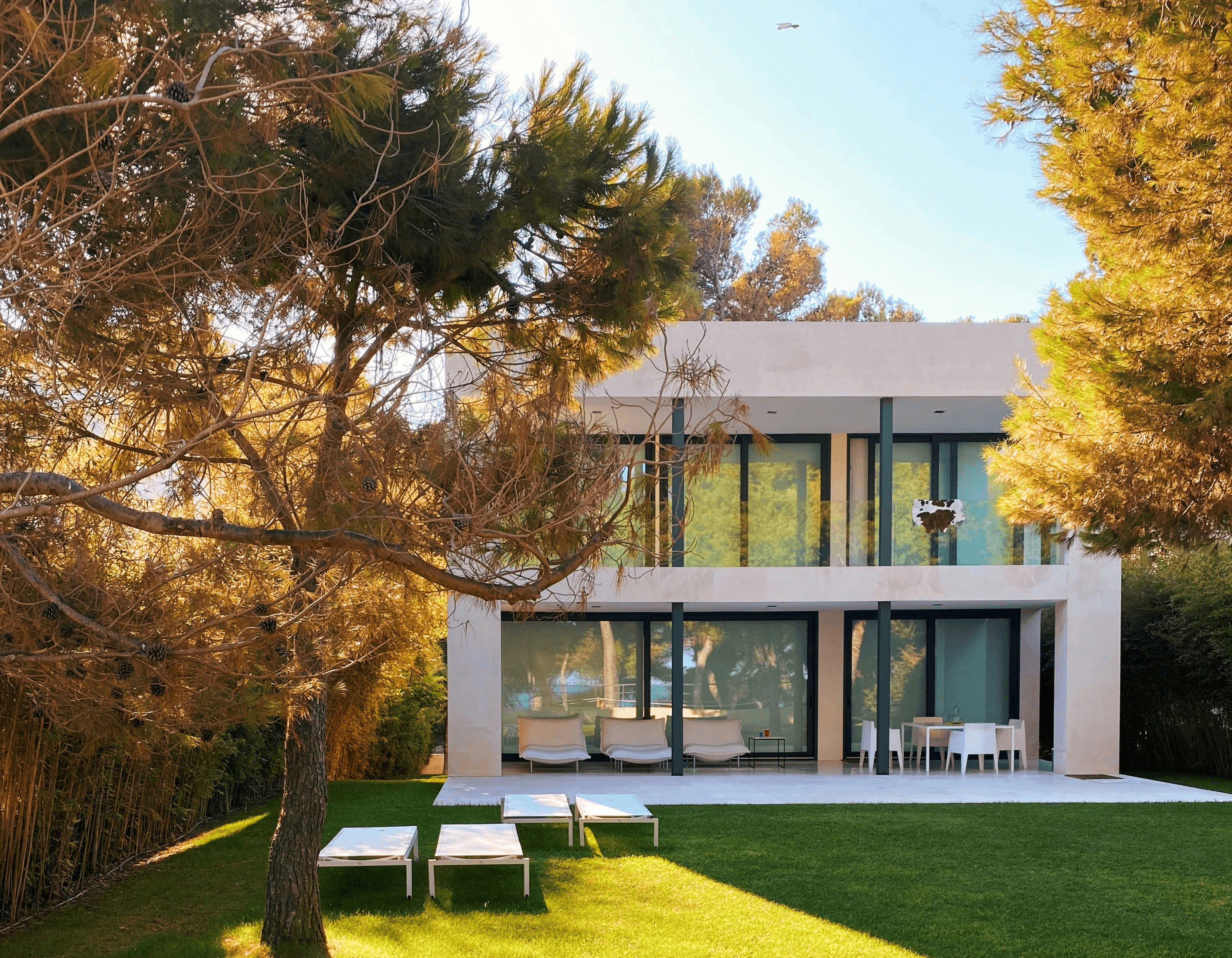 white and brown concrete building near green grass field during daytime