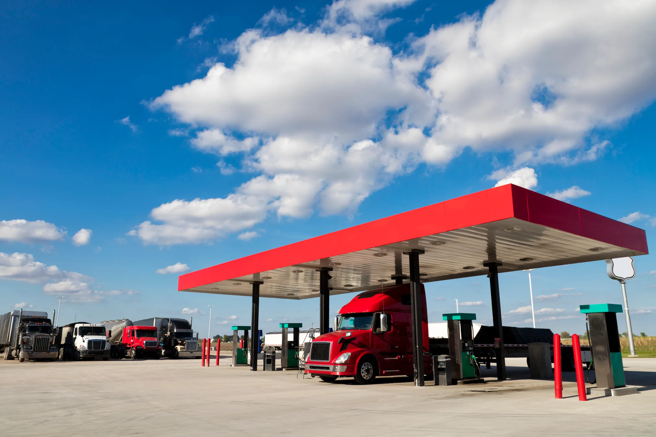Semi trucks refueling at a diesel truck stop as fuel prices rise for the trucking industry