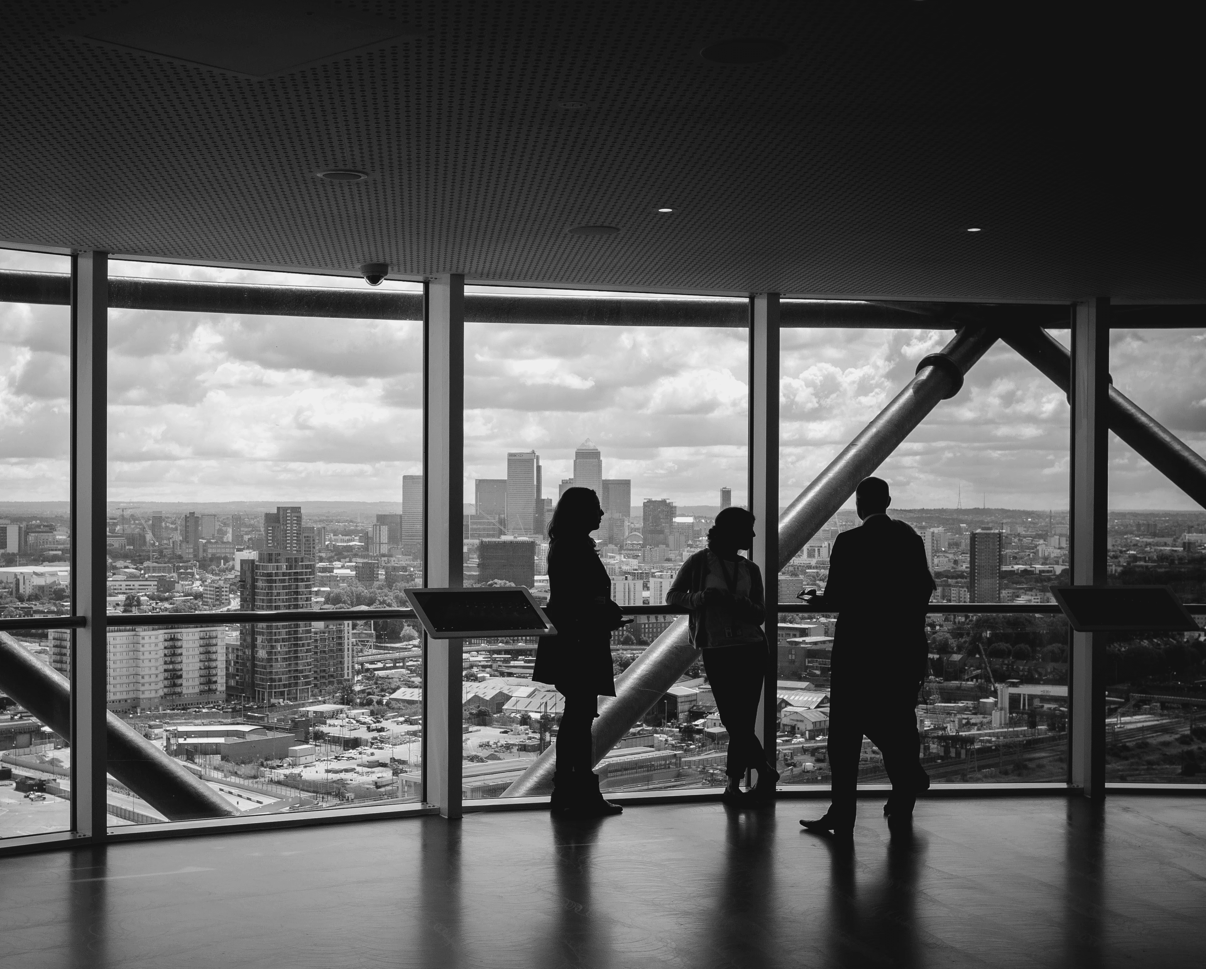 people standing inside city building
