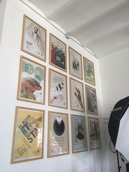 posters framed and hung on the wall