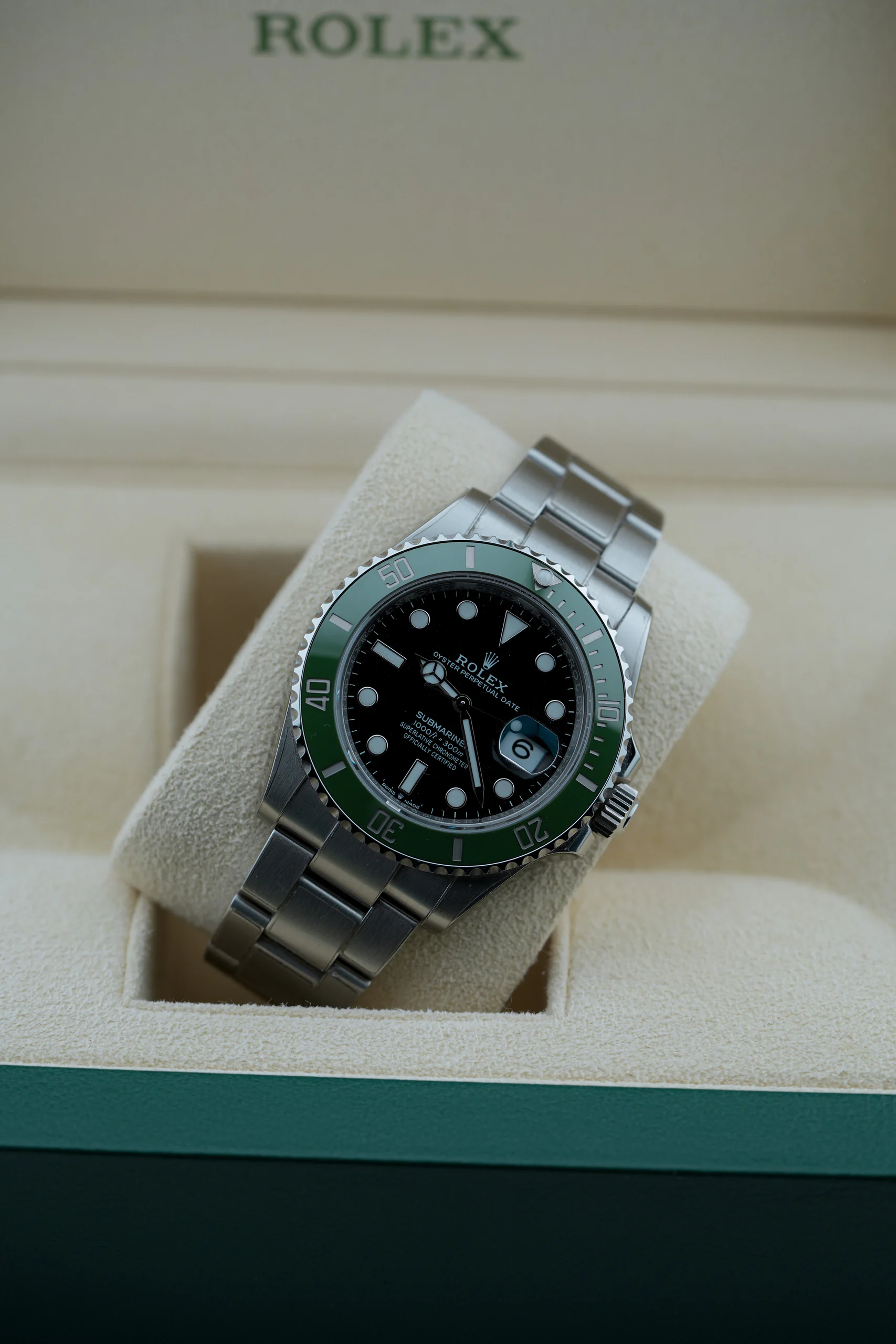 Rolex Submariner Date Starbucks 126610LV resting in a watch box
