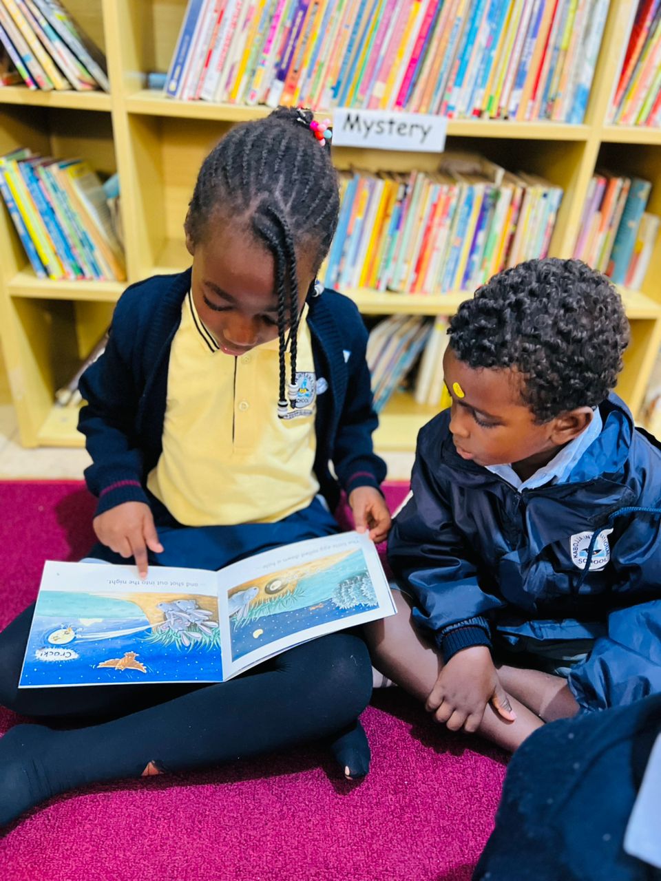 A school building stands against the backdrop of a clear sky