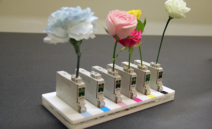 close-up of flowers held in color printer cartages