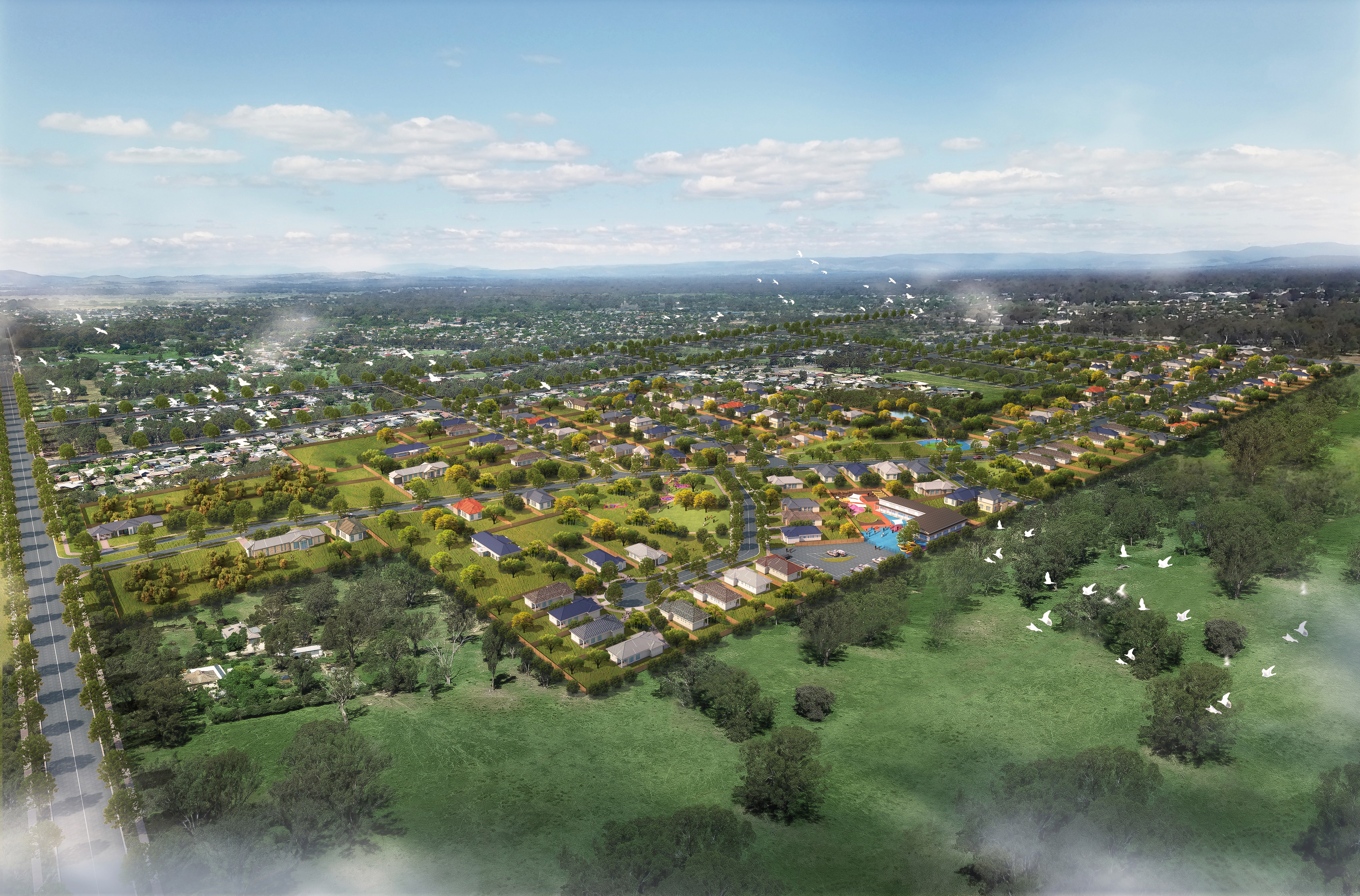 A modern living room with a double-height ceiling and large windows.