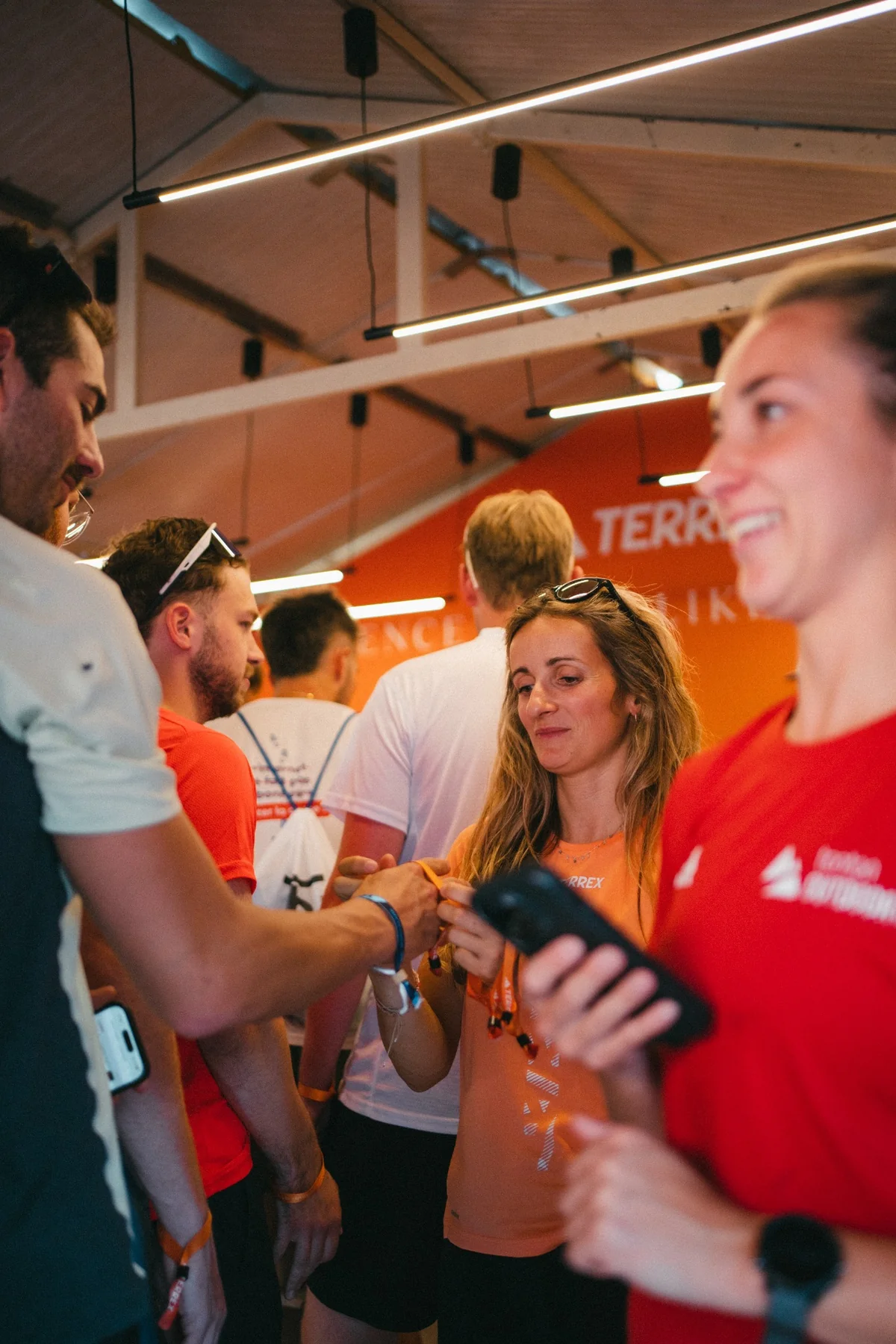 Volunteers badging guests at the booth entrance