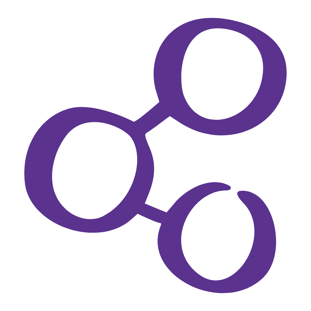 Restaurant interior with wooden tables and chairs lined against a textured wall, softly lit by round wall lamps.