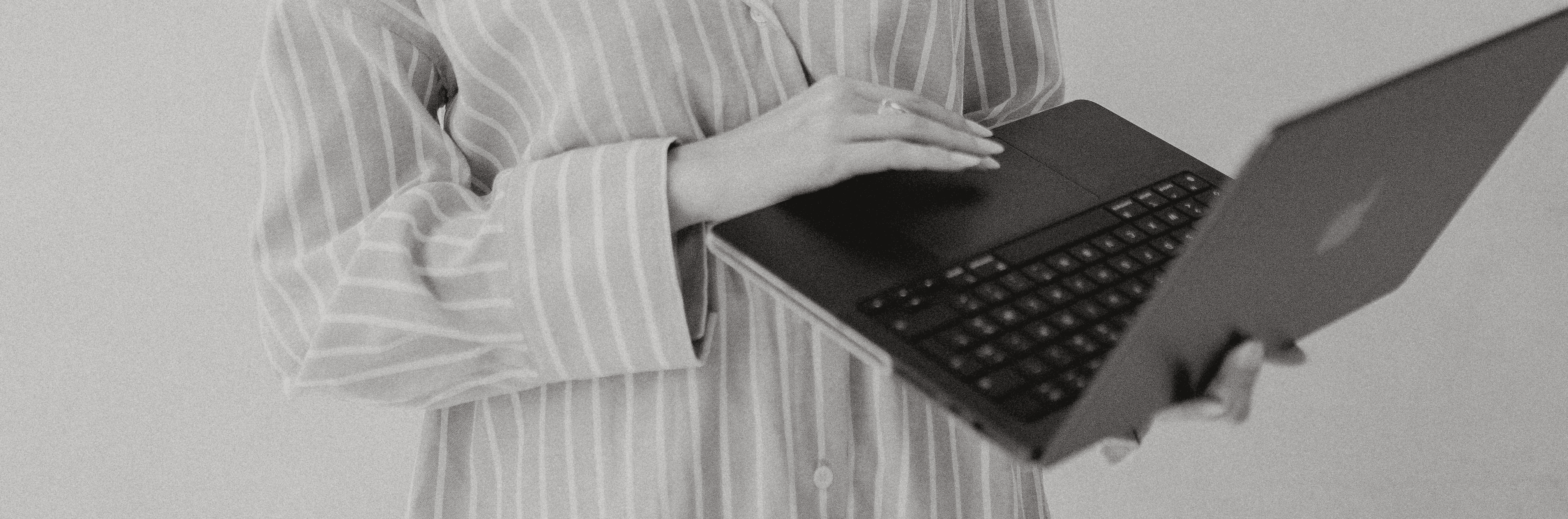 man in black shirt sitting in front of computer