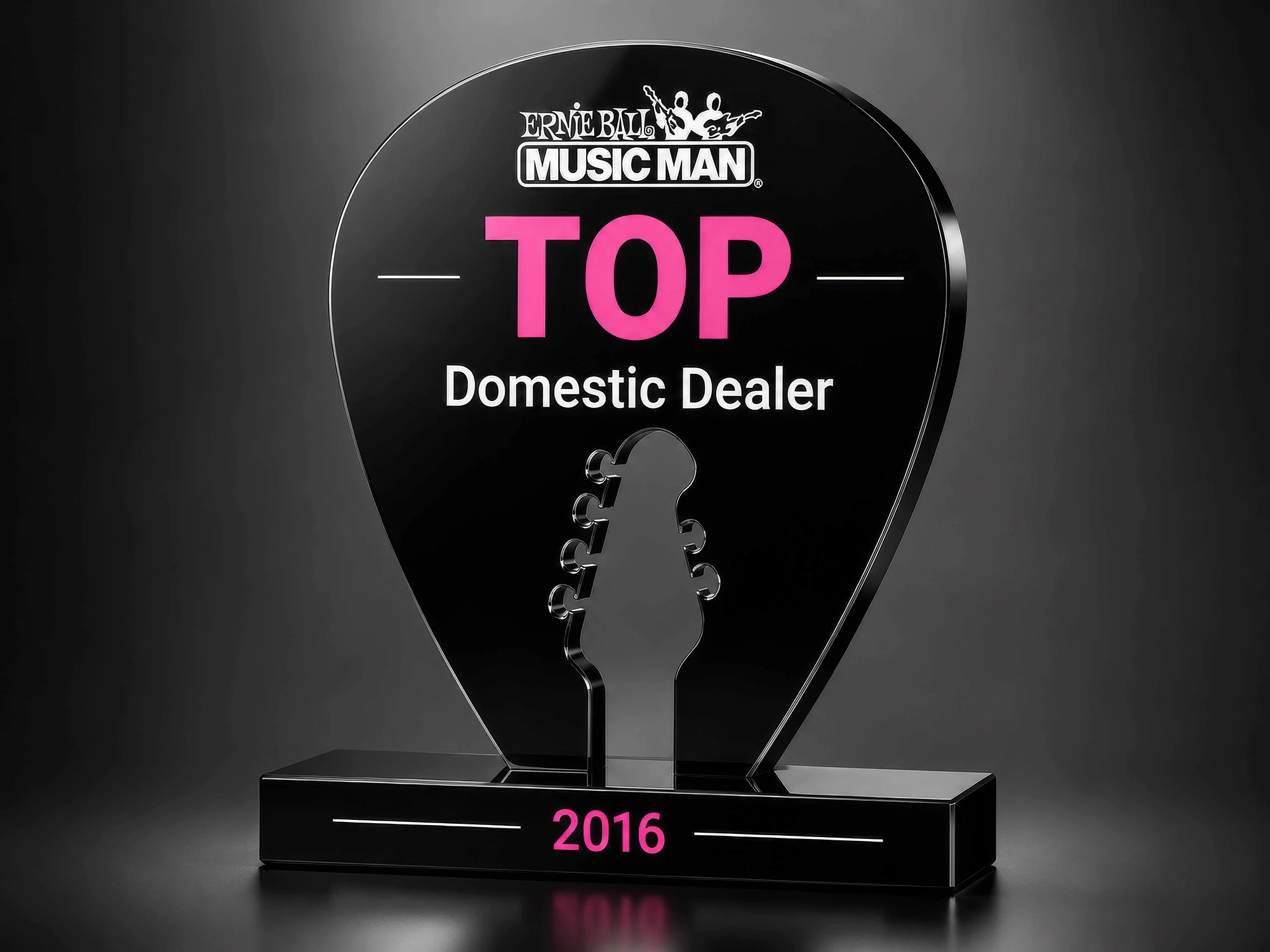Ernie Ball Music Man Award in shape of pick with headstock cut out of center