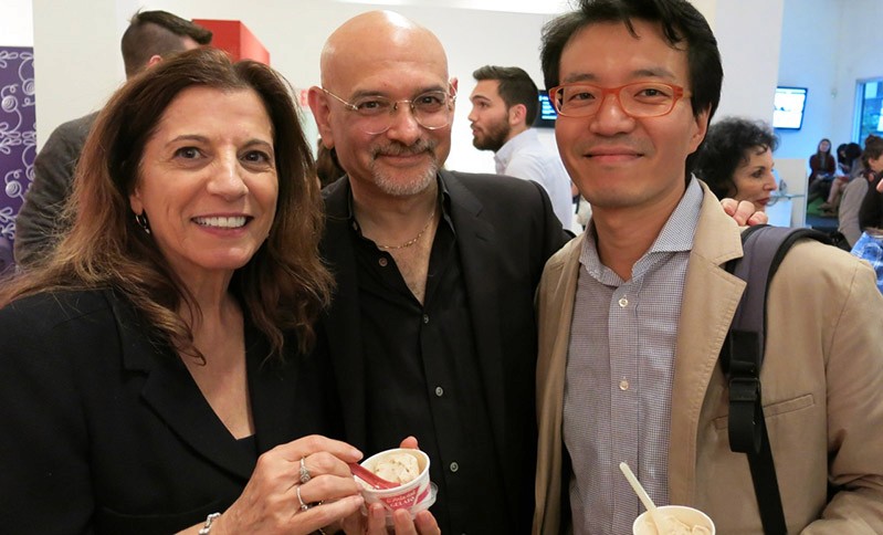 portrait of two men and a woman dressed in black