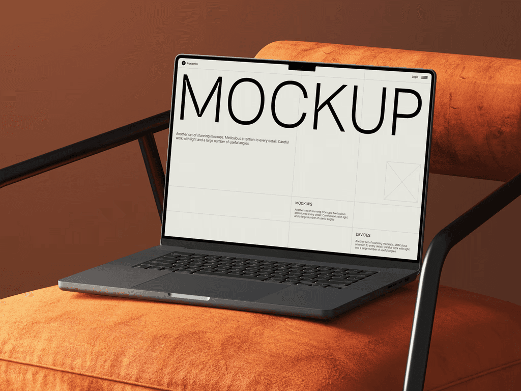 Laptop on an orange upholstered chair displaying a website with 'MOCKUP' text against a warm brown background.