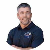 Image close up of male past client who is smiling.