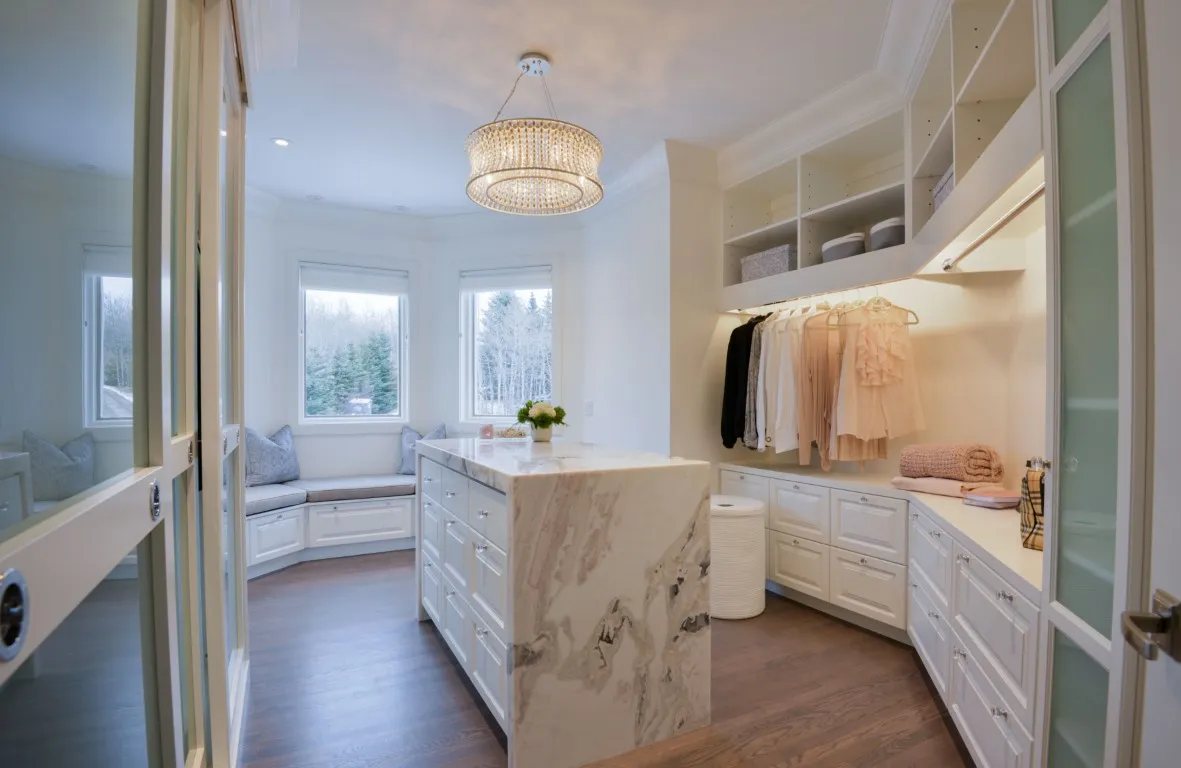 Image of Luxury primary ensuites with marble island and built-in cabinetry showcasing KHD Homes design-build expertise.