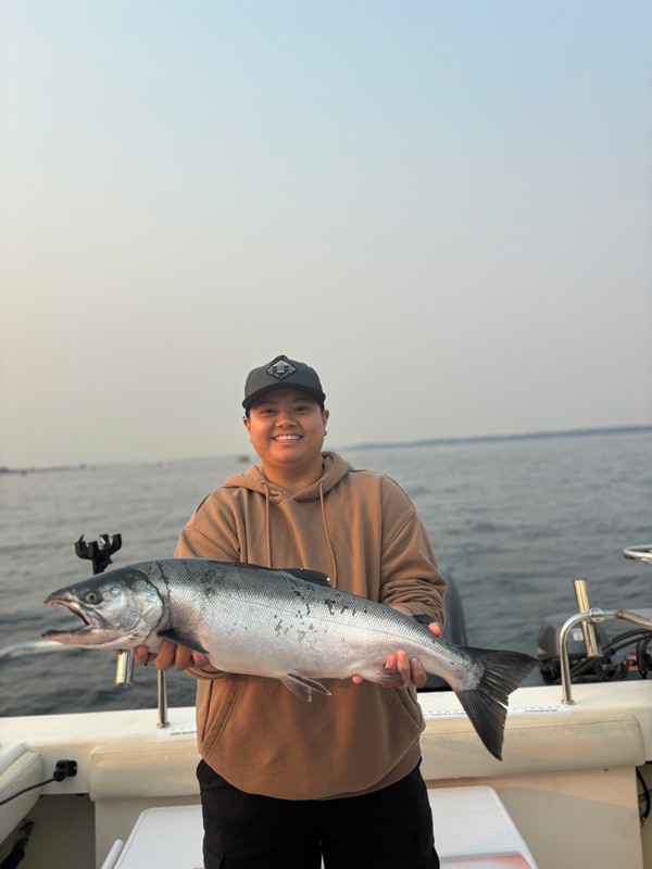 Holding trophy coho salmon