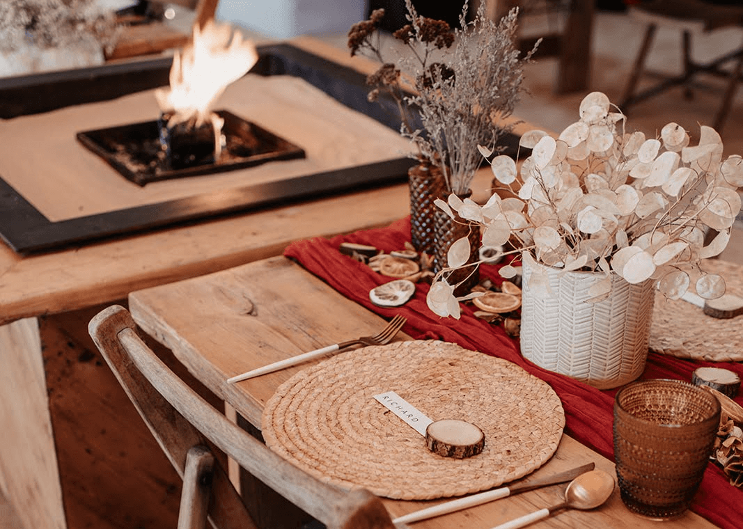 Natural table decoration with open fire pit