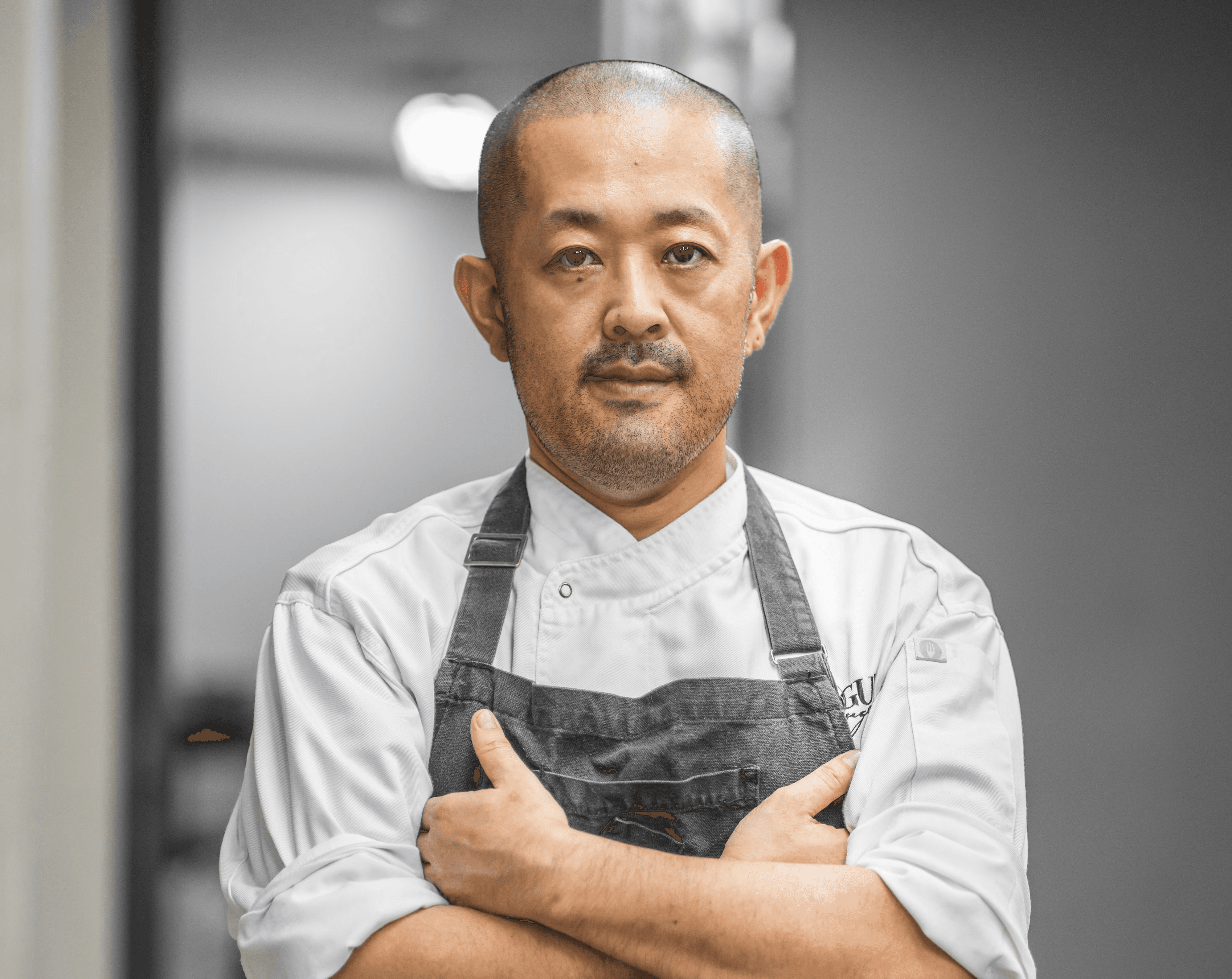 man in white button up shirt and black vest