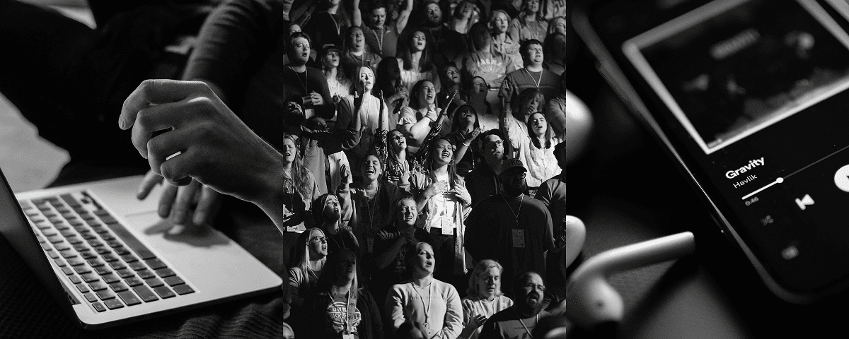 Portrait of a woman with curly hair wearing a two-tone gray and orange beanie against a neutral background.