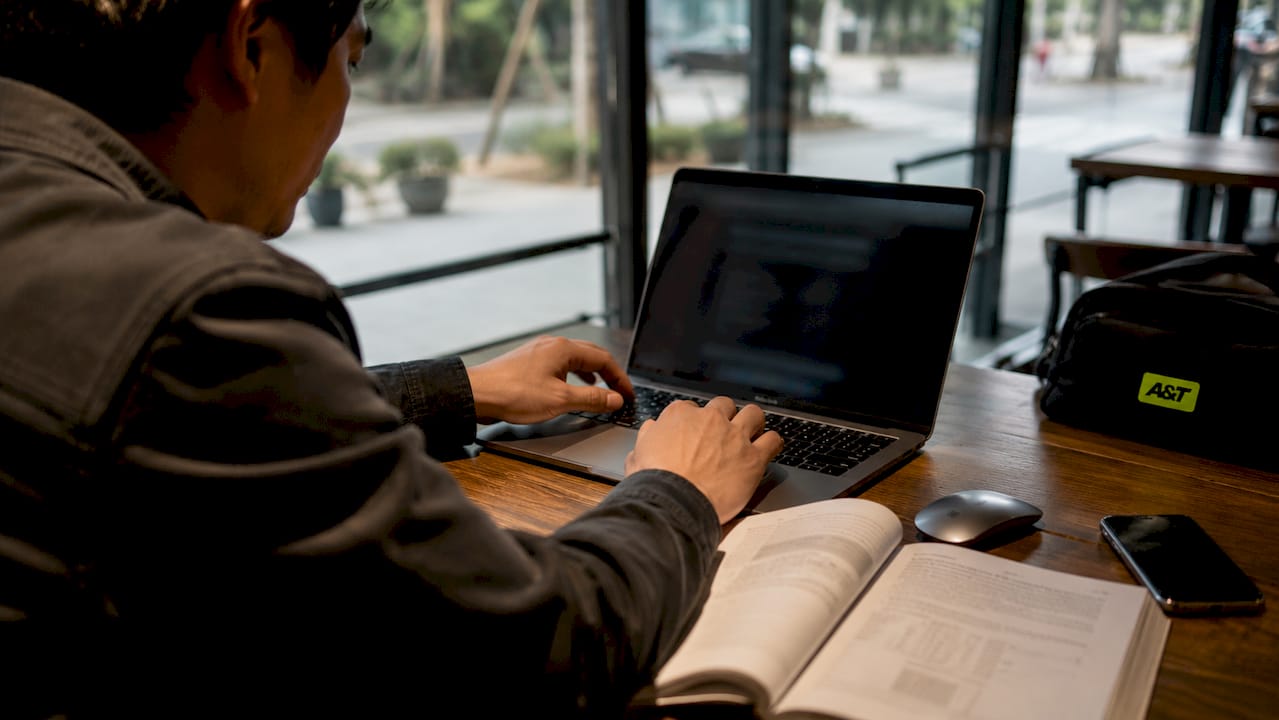 Man adjusting computer settings for page speed