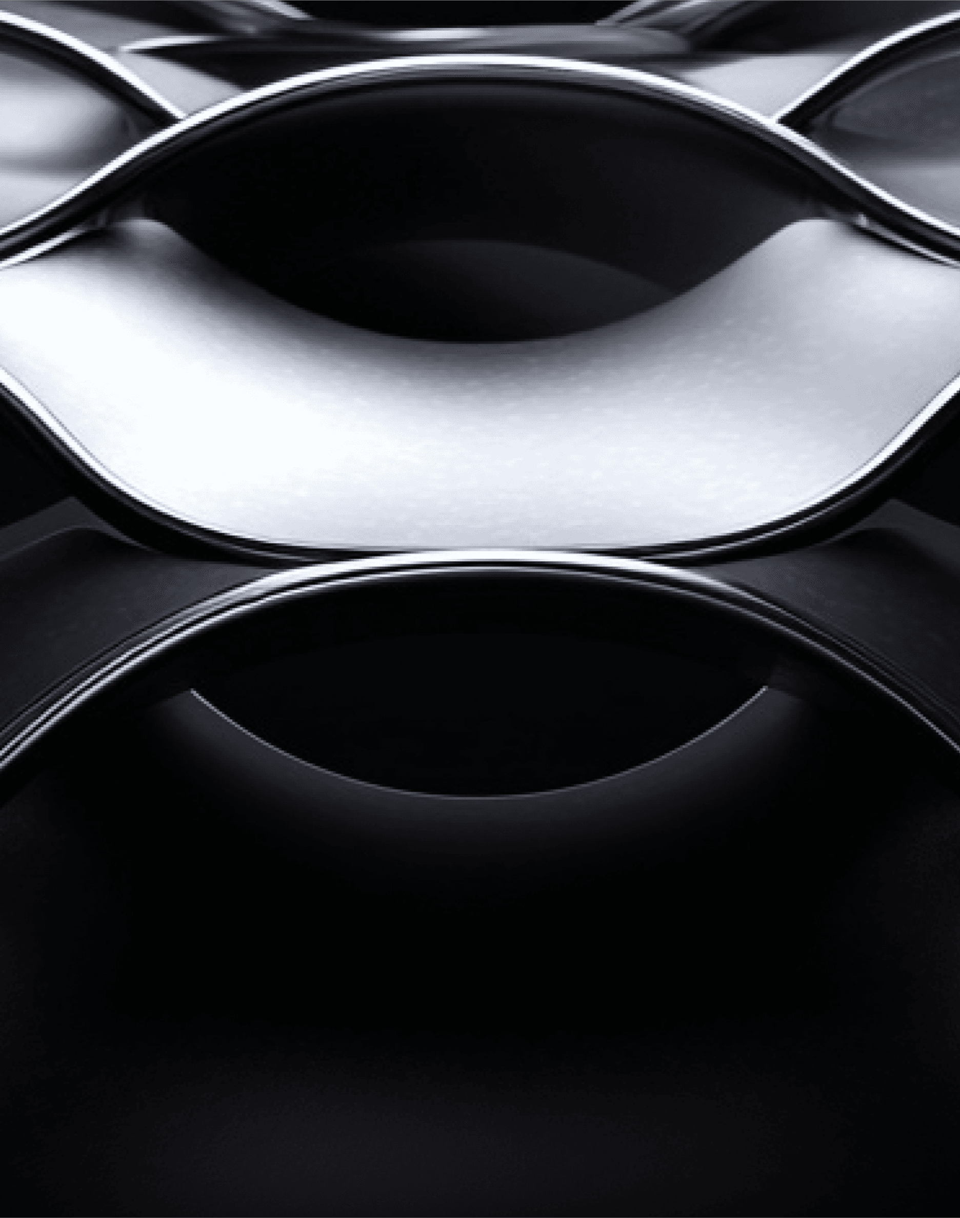 Sleek, reflective metallic arcs forming elliptical patterns, symbolizing adaptability and futuristic innovation.