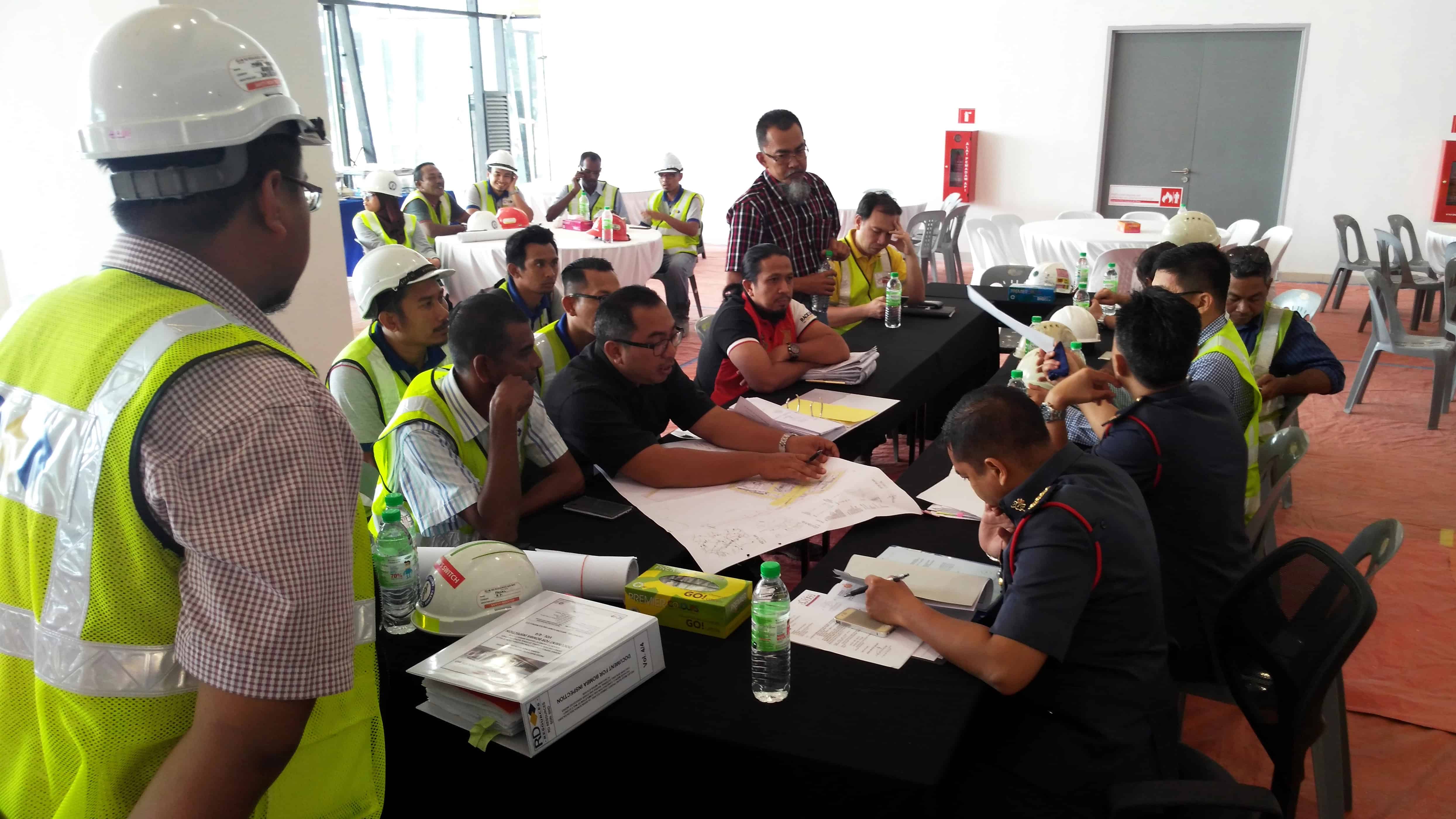 Safety meeting to discuss psychsocial risks inherent in the work activities