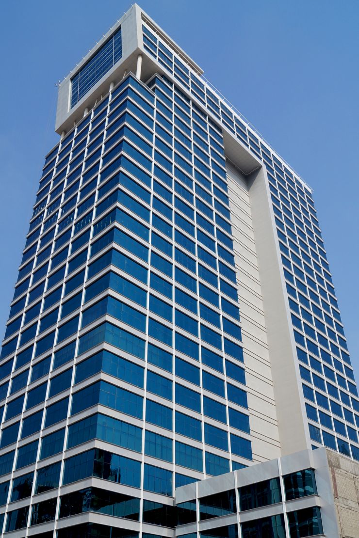 Corner perspective of this modern commercial building, highlighting sleek architecture and premium office space.