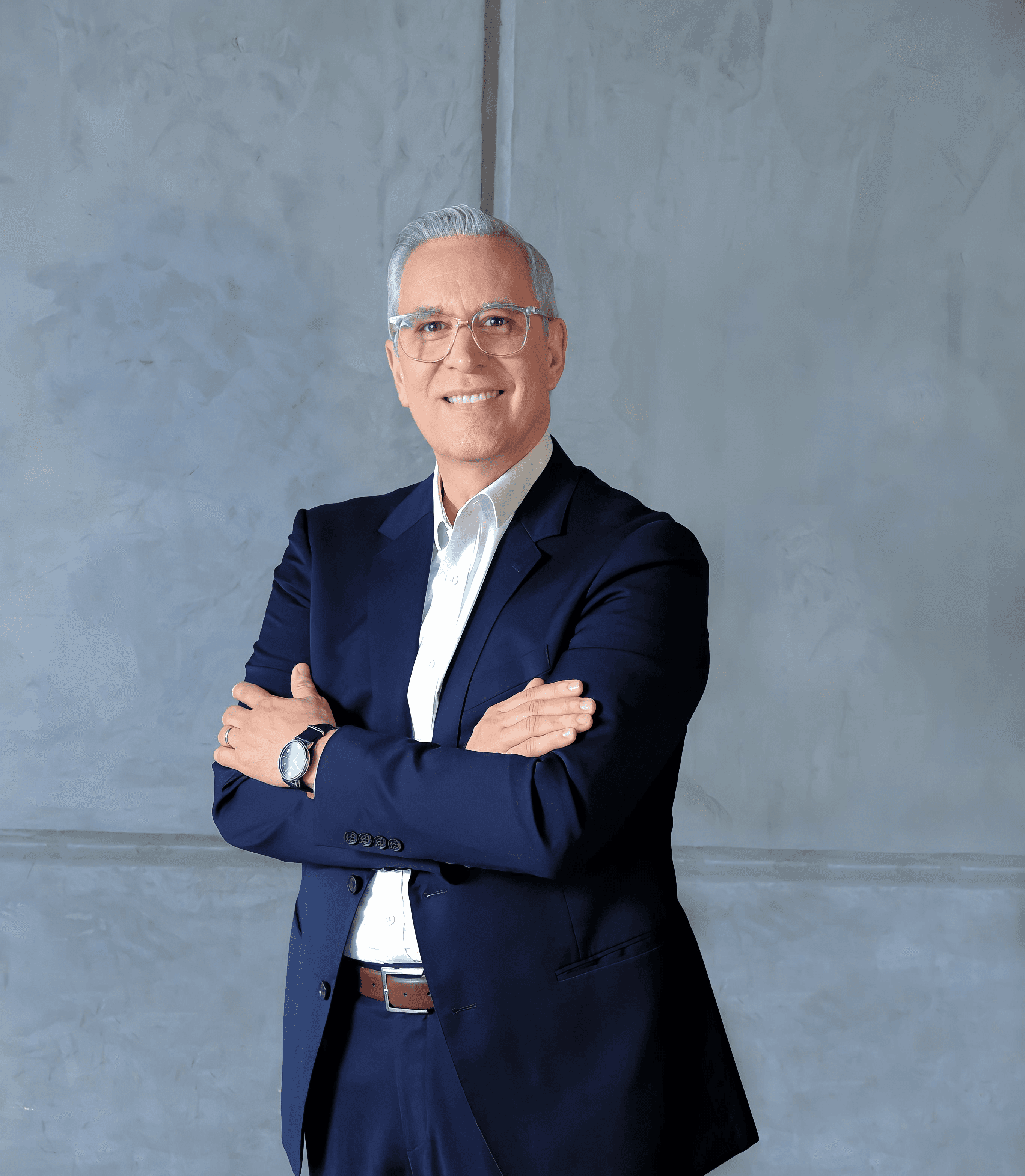 a man in a suit and tie posing for a picture