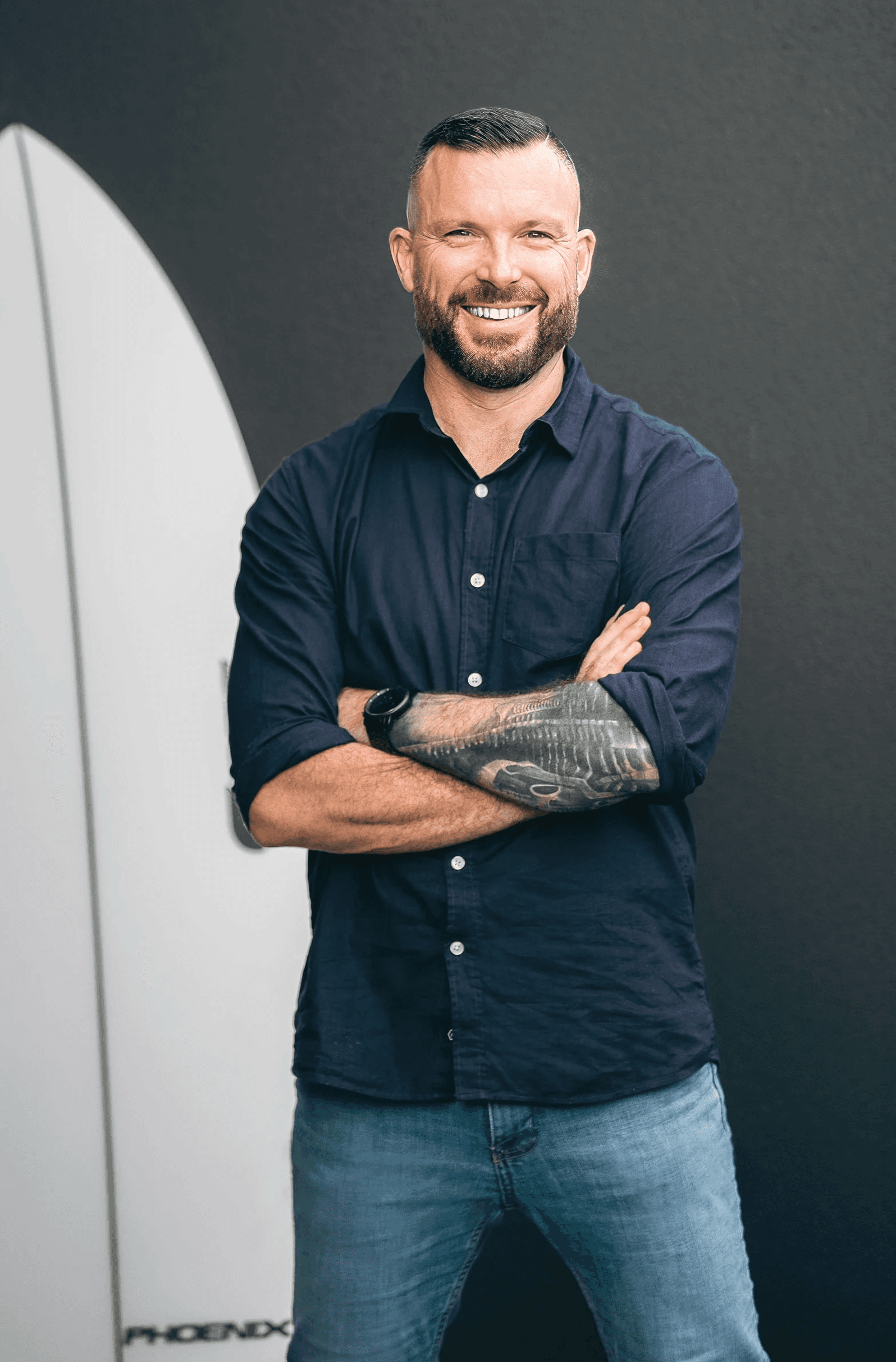 Portrait of a person in dark clothing speaking on a phone