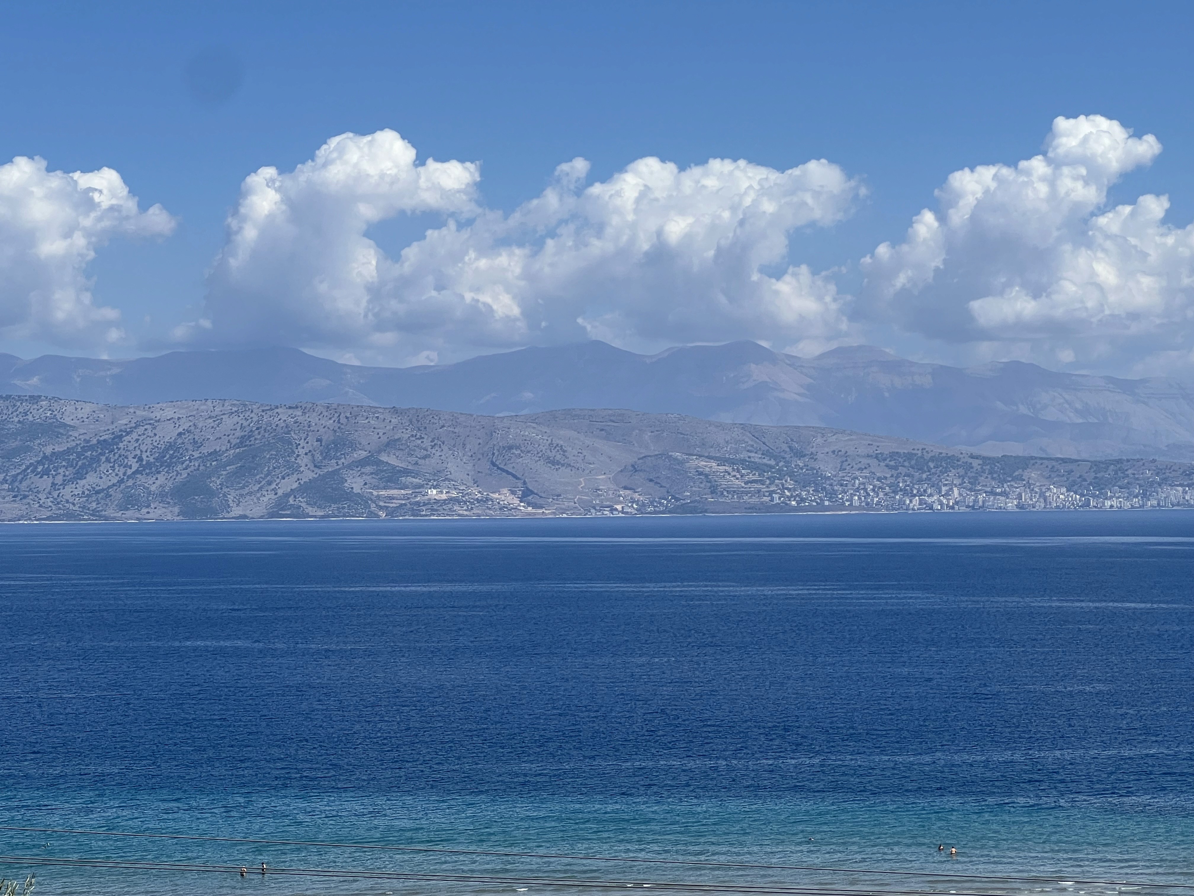 blue sky and white clouds over the sea