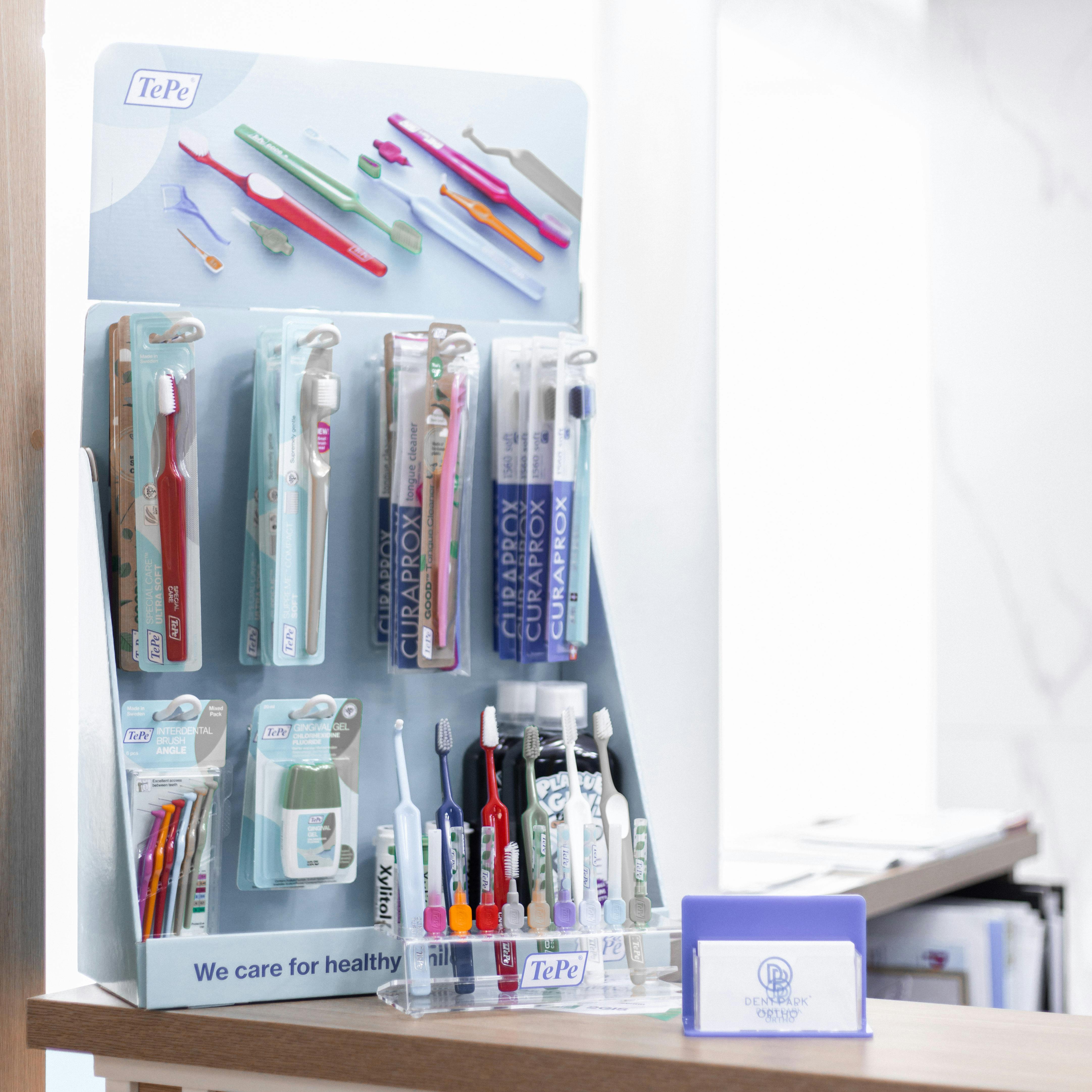 wall with toothbrushes and other dental products
