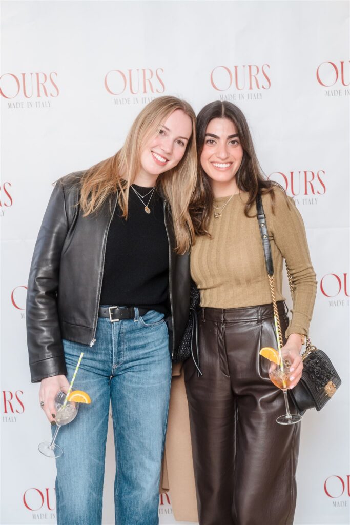 Two attendees in leather trousers and a black leather jacket enjoying cocktails, perfect for Aspen luxury corporate event ideas centered around après-ski style and modern fashion.