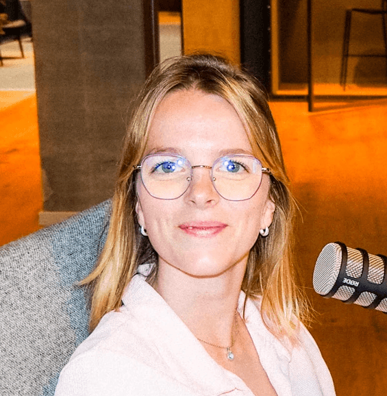 Stéphanie smiling, while recording a podcast episode.