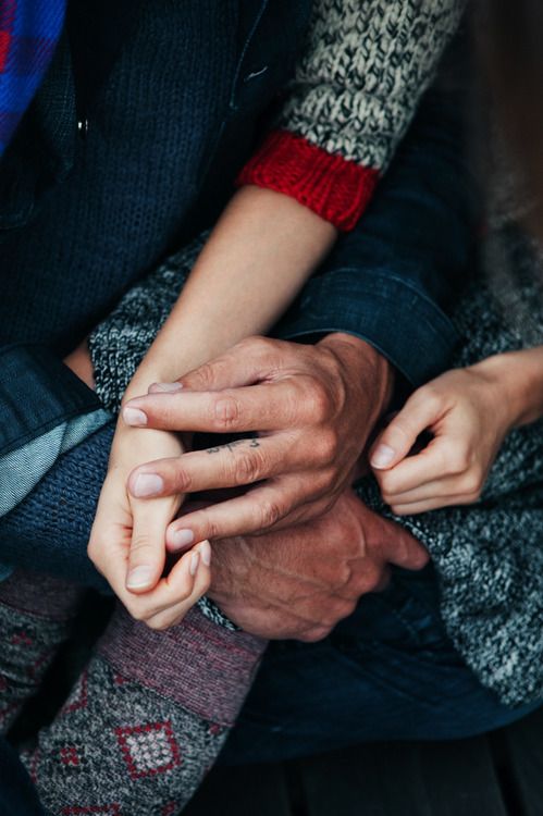Elf woman in white dress raising hands by the river