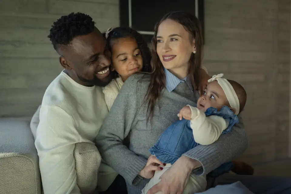 A family with baby on mother hands