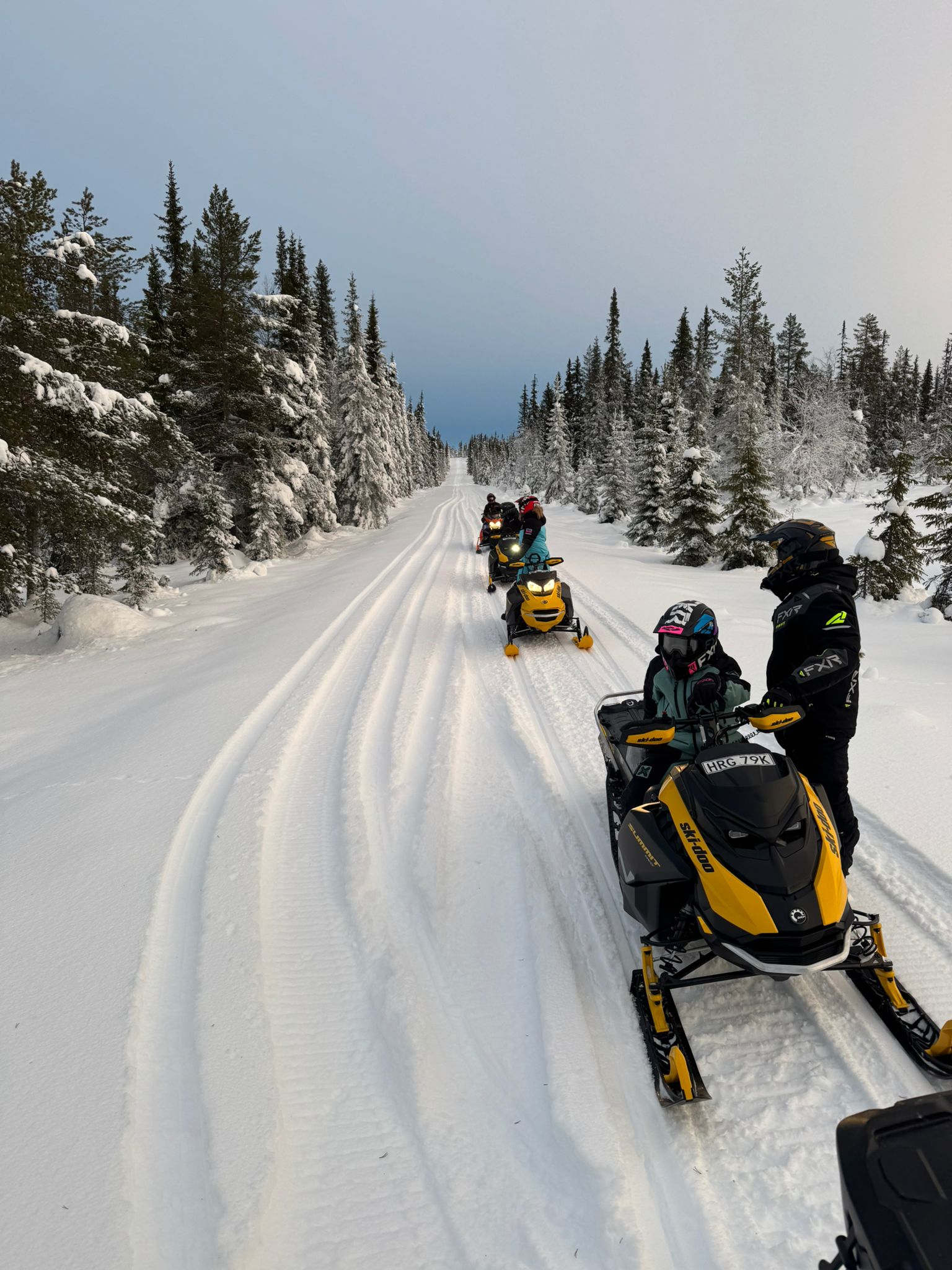 two people riding jet skis on a body of water