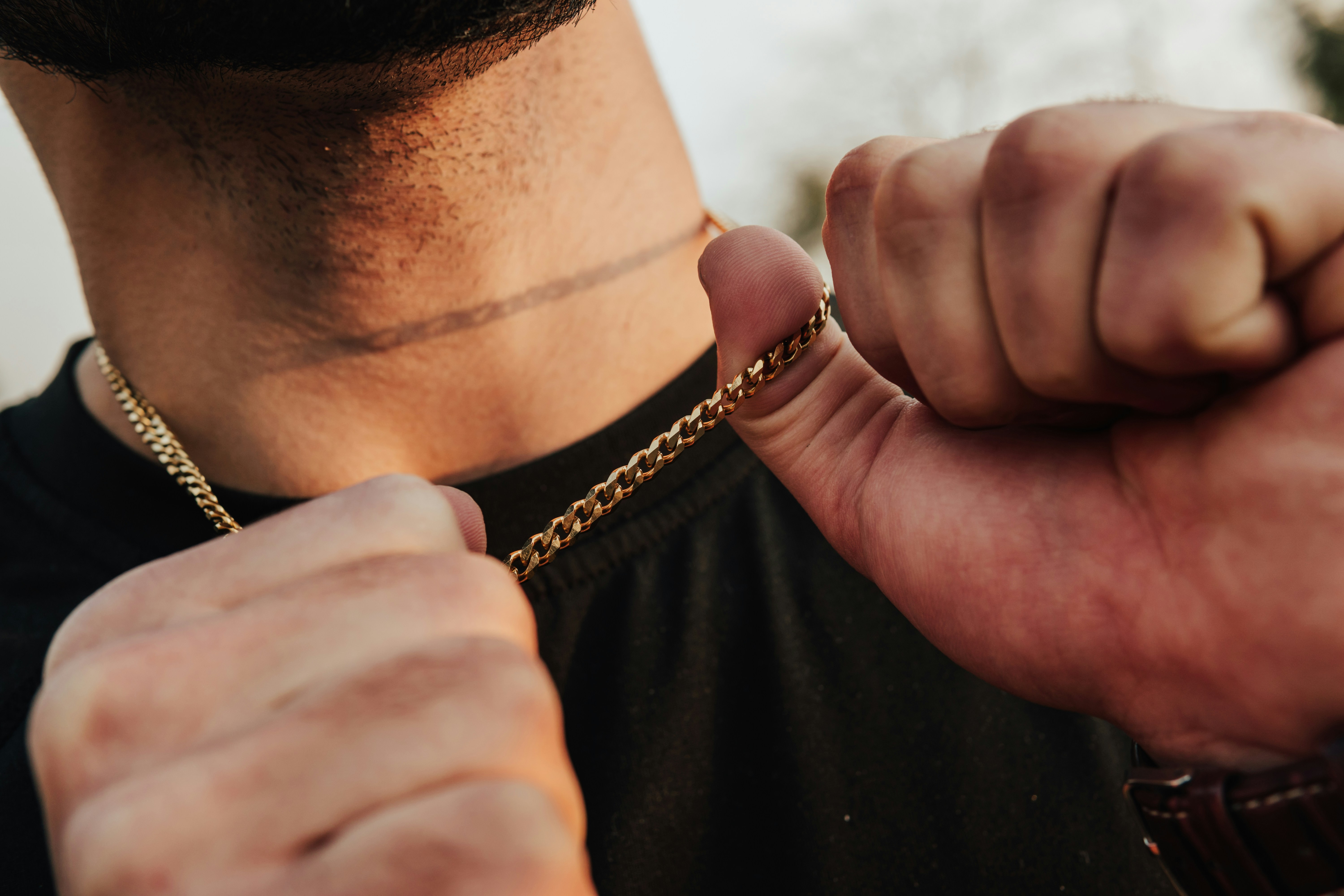 Lifestyle product photo featuring Cold Vault gold chain on model
