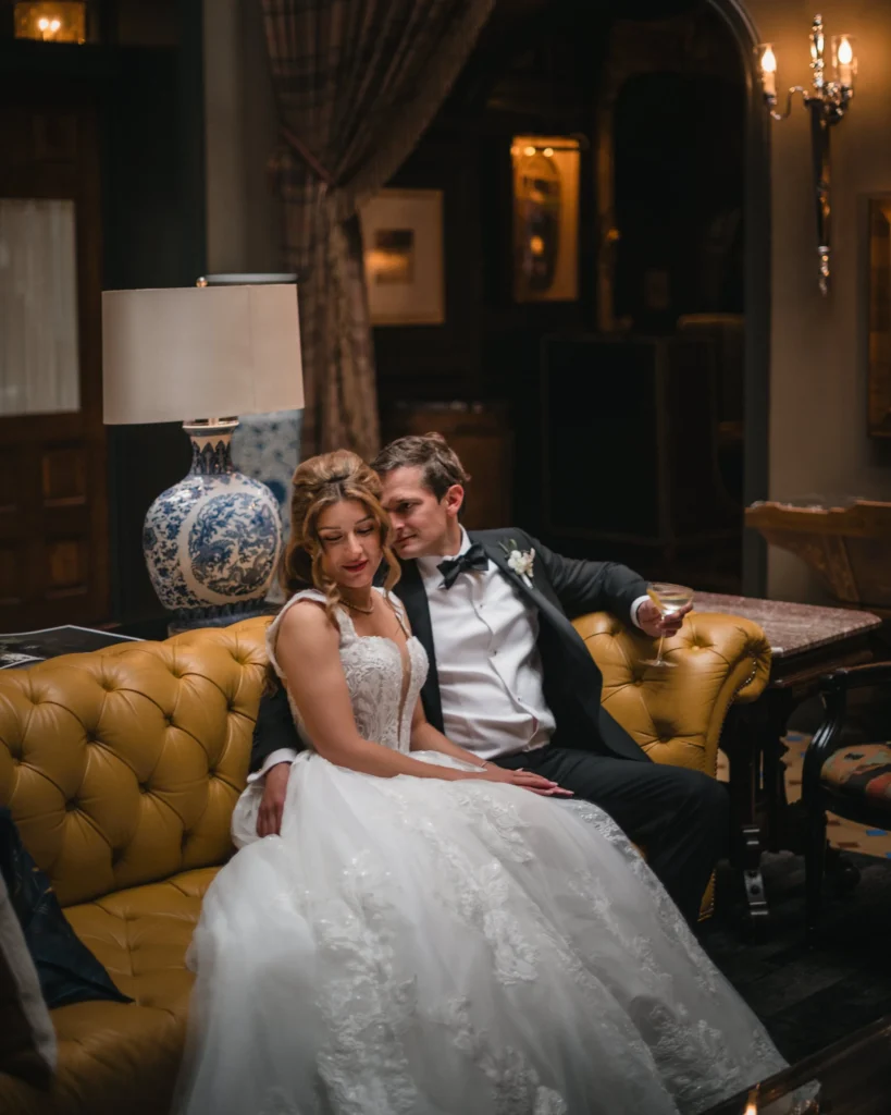 Bride and groom relaxing together indoors at Aspen Meadows Resort Wedding