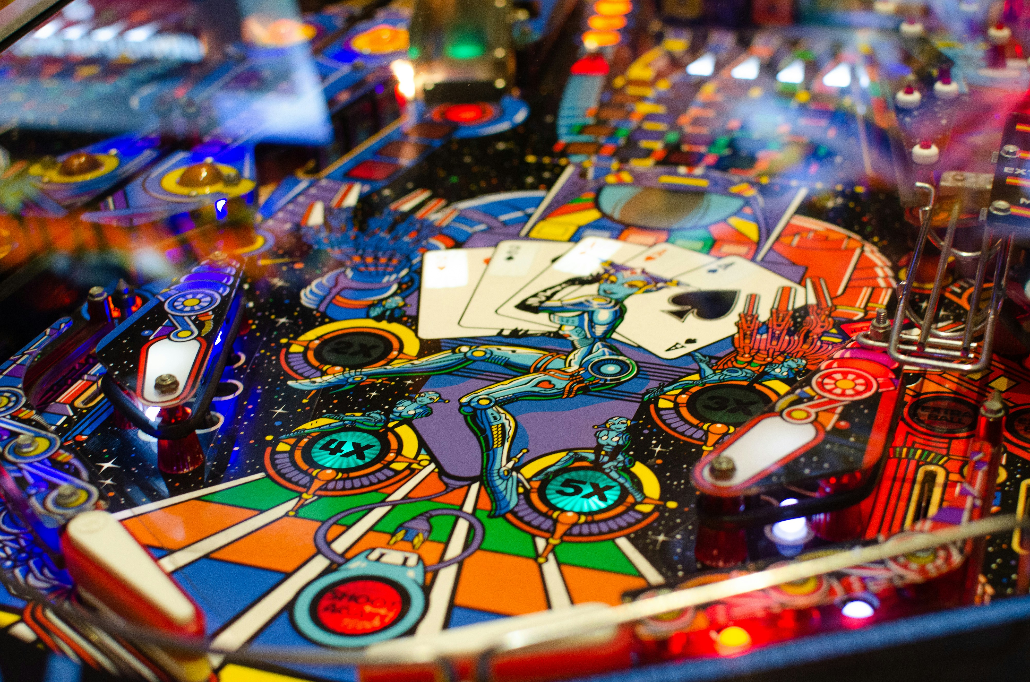 Colorful close-up of a retro sci-fi pinball machine symbolizing the fast-paced, unpredictable world of AI SEO where a strong EEAT strategy is essential to scoring high in generative search engines.