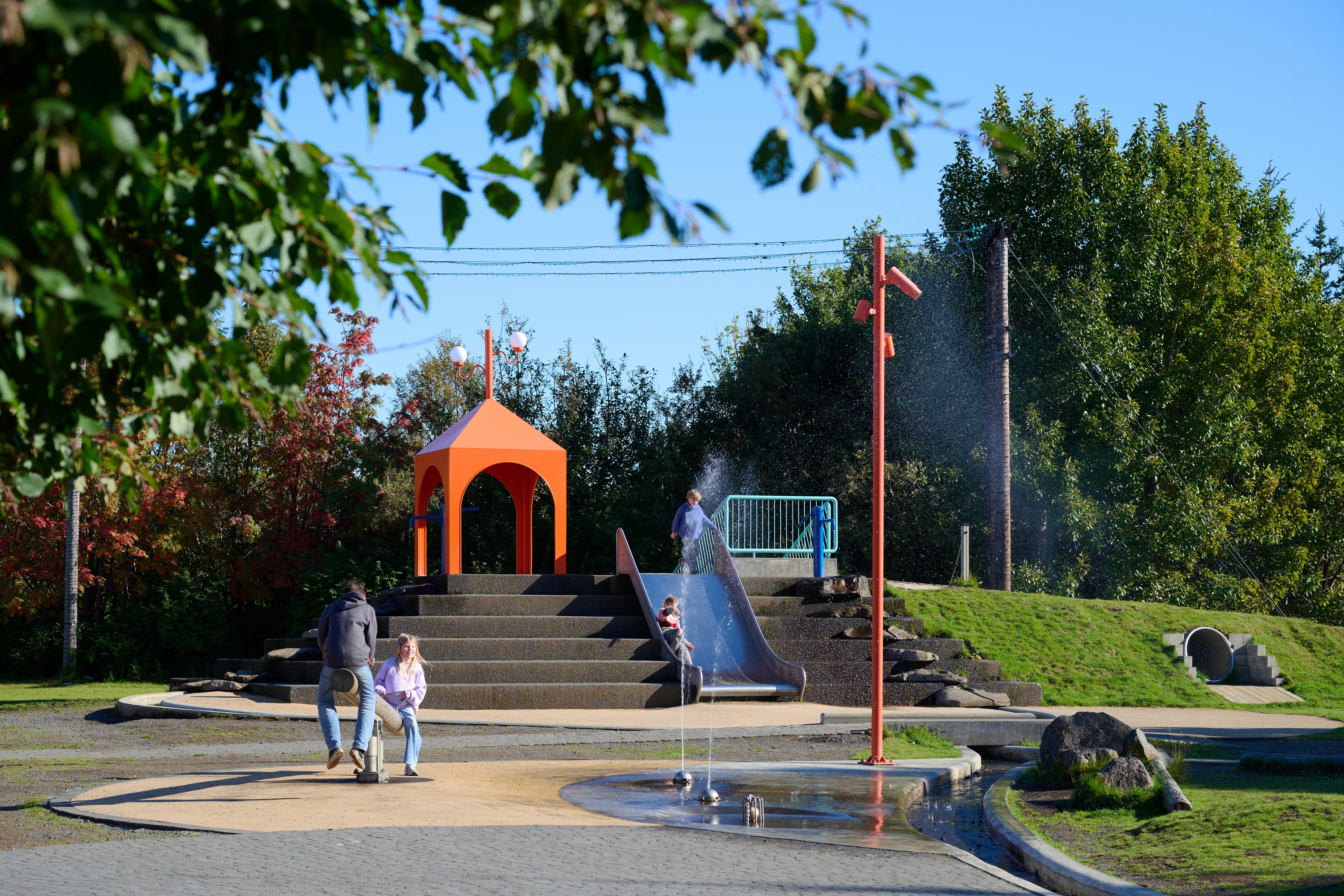 The bright green Northern Lights swirling over Grótta Lighthouse and the dark Atlantic coast in Reykjavík. Photo by Visit Reykjavík.