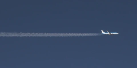 A plane flying across the sky